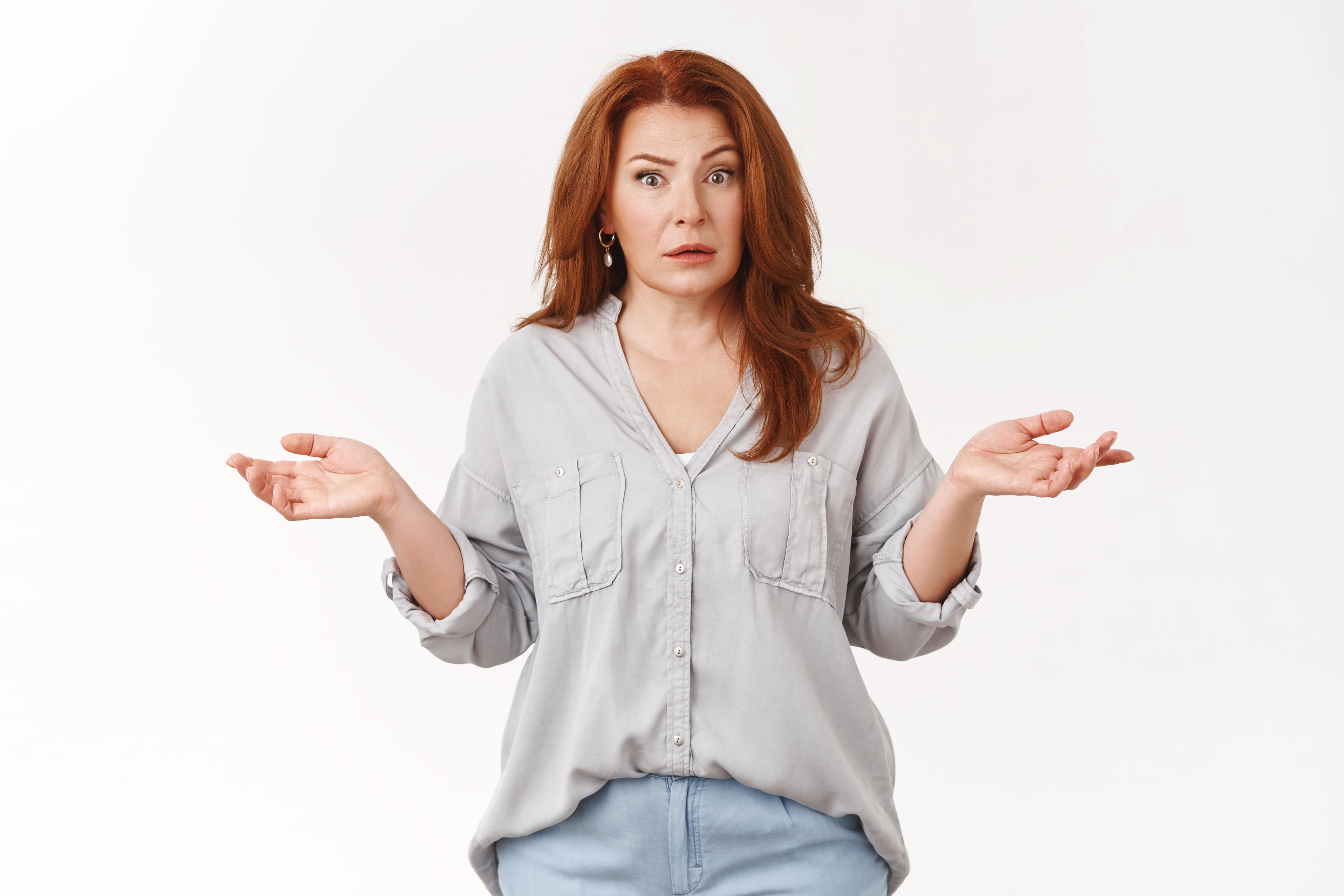 A mother shrugging her shoulders | Source: Shutterstock