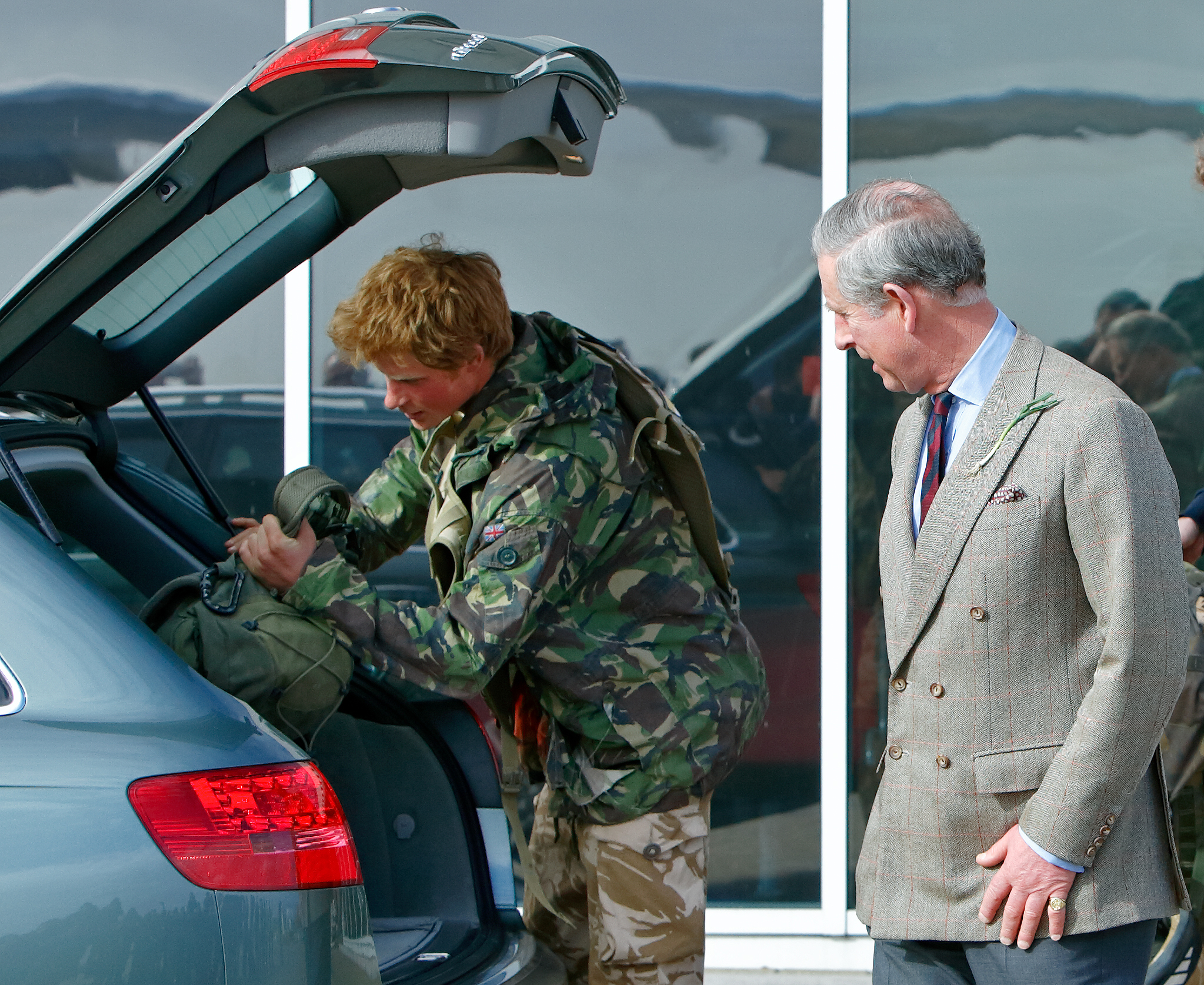 Prince Harry loads his kit bags in the company of his father Prince Charles on March 1, 2008 in Brize Norton, England | Source: Getty Images