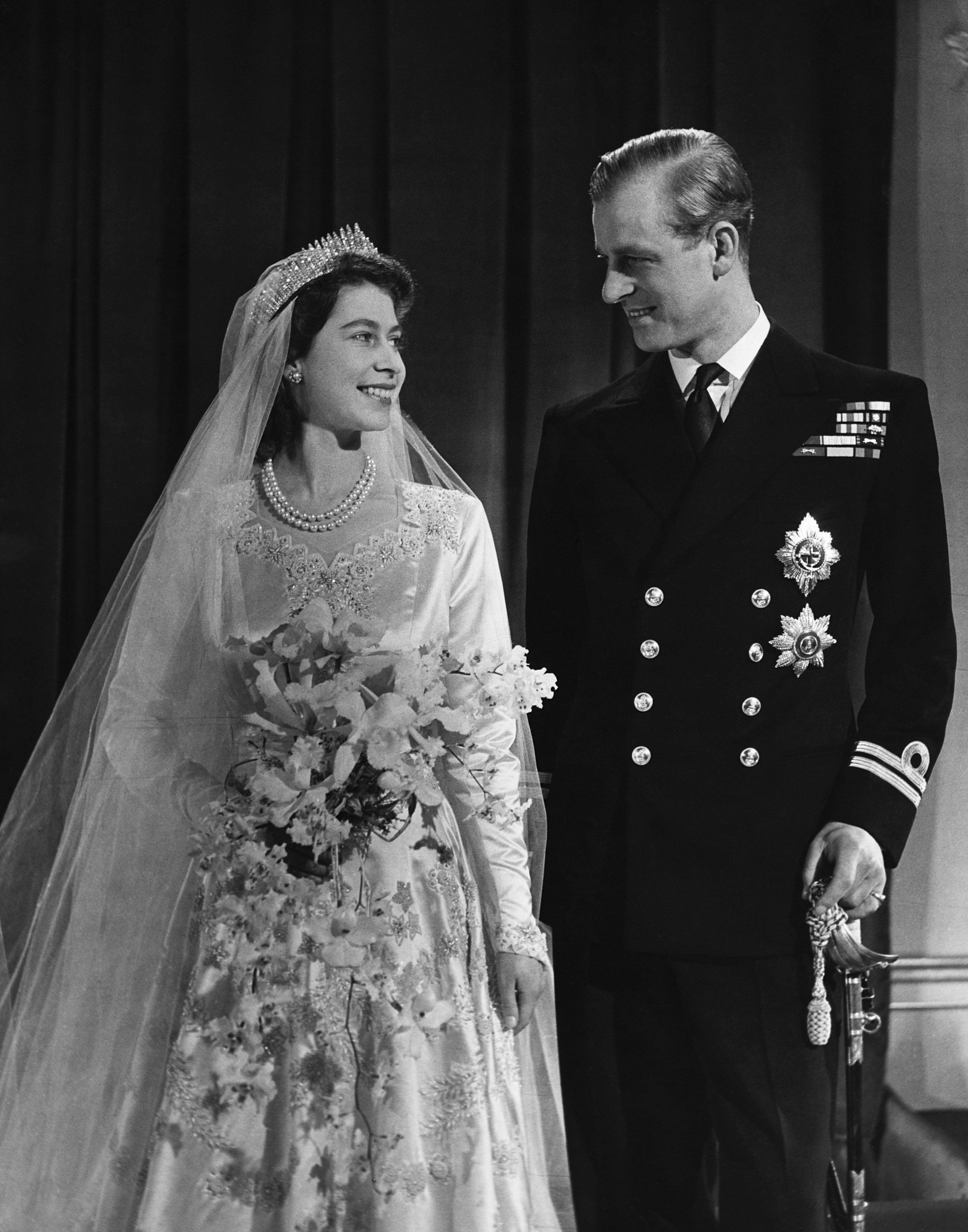 Queen Elizabeth II with Phillip, Duke of Edinburgh, after their wedding in 1947. | Source: Getty Images.