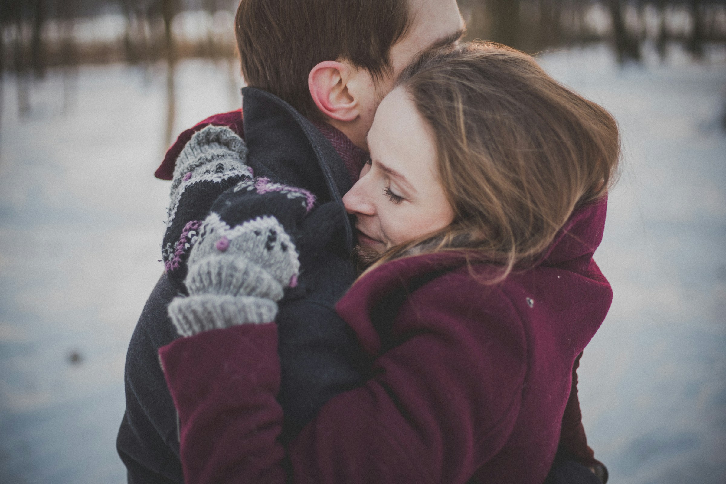 A couple hugging in winter | Source: Unsplash
