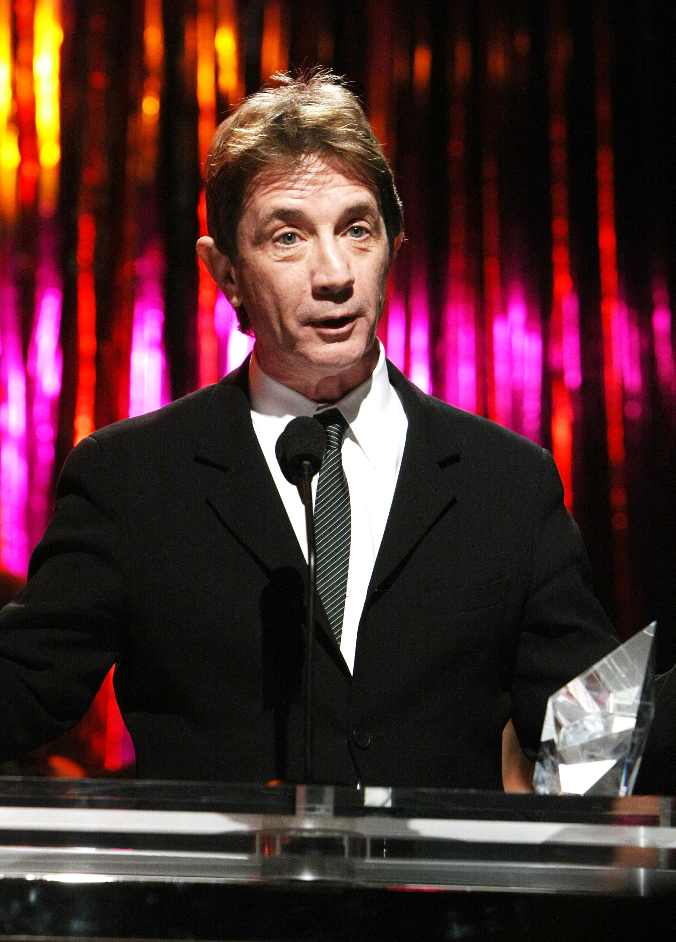 Martin Short accepts the Courage Award on behalf of late wife Nancy Dolman onstage at the 14th annual Unforgettable Evening benefiting EIFs WCRF held in Beverly Hills, California, on February 10, 2011. | Source: Getty Images