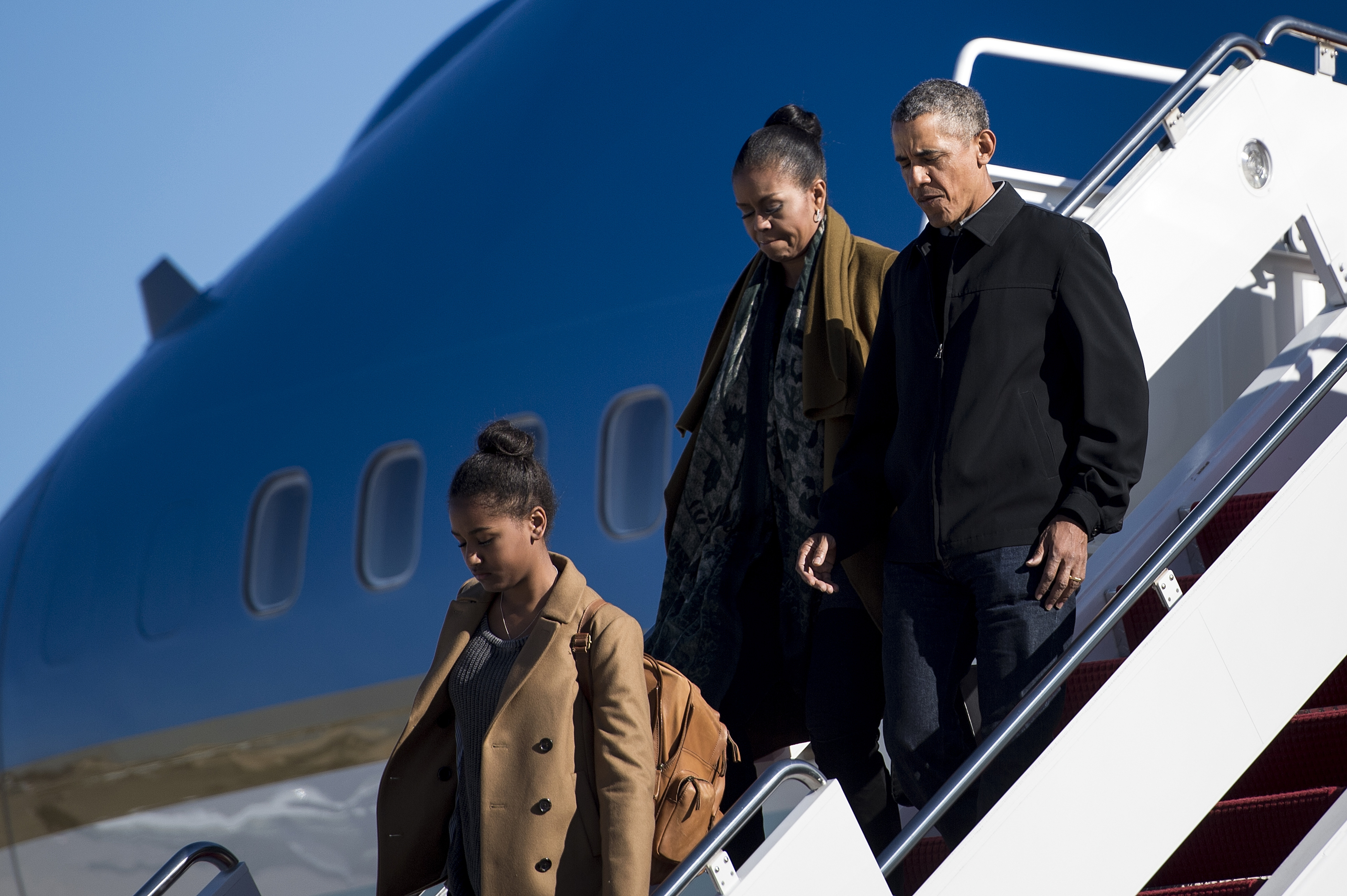 Sasha Obama, Michelle Obama and Barack Obama arrive at Andrews Air Force Base on January 3, 2016 in Maryland. | Source: Getty Images