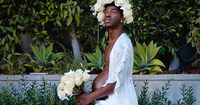Rapper Lil Nas X showing his "baby bump" during a photoshoot for his upcoming album "Montero" | Photo: Instagram.com/lilnasx/