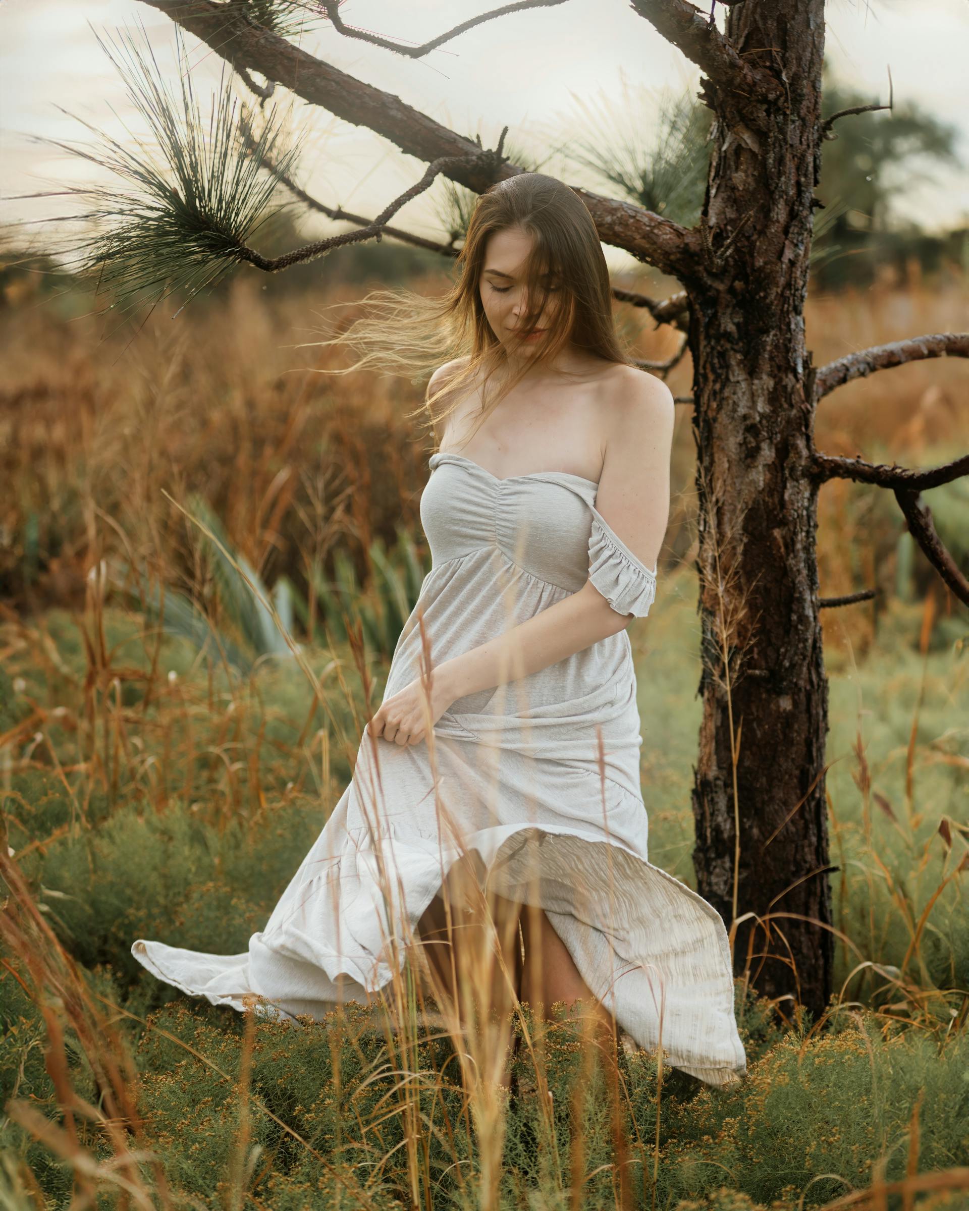 A young woman in a white dress in a field | Source: Pexels