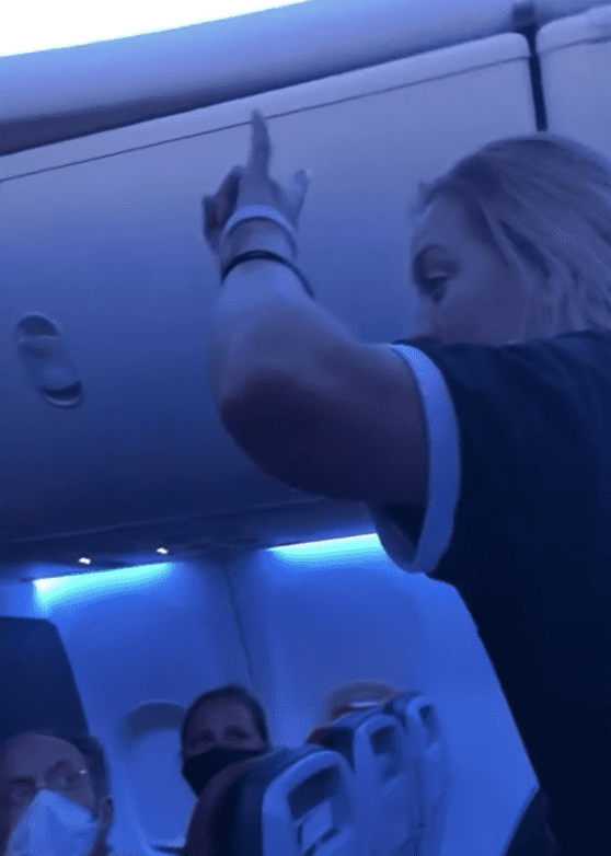 In a viral YouTube video a woman on a plane causes commotion as she shouts at fellow passengers | Photo: Youtube/Jackson VanHoose