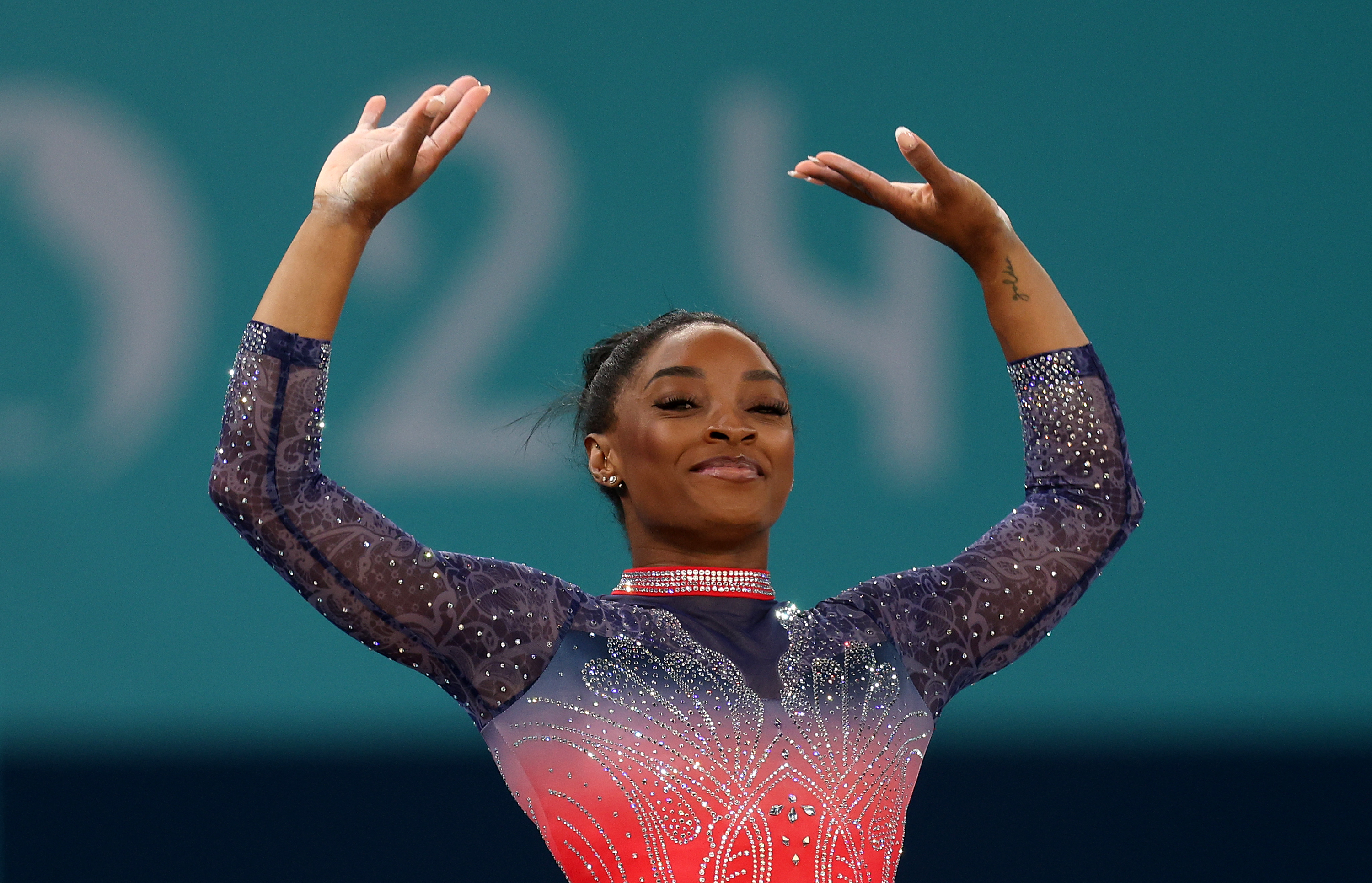 Simone Biles raises her arms while competing in the Women's Floor Exercise Final at the Paris 2024 Olympics on August 5, 2024 | Source: Getty Images