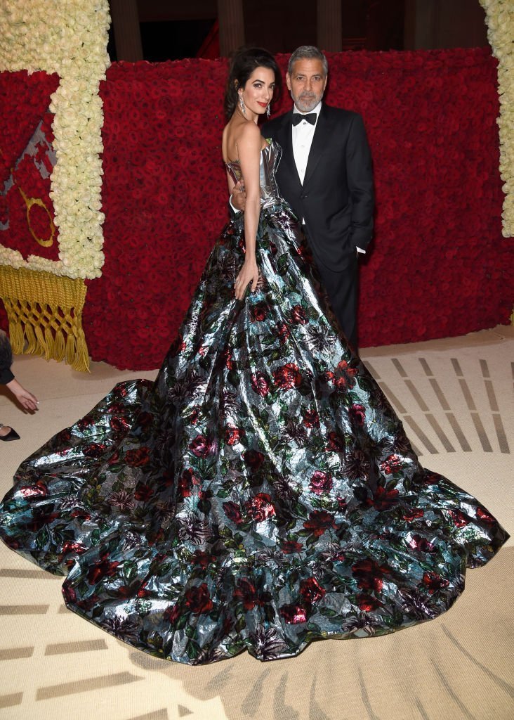  2018 Met Gala Host, Amal Clooney and George Clooney attend the Heavenly Bodies: Fashion & The Catholic Imagination Costume Institute Gala at The Metropolitan Museum of Art | Getty Images