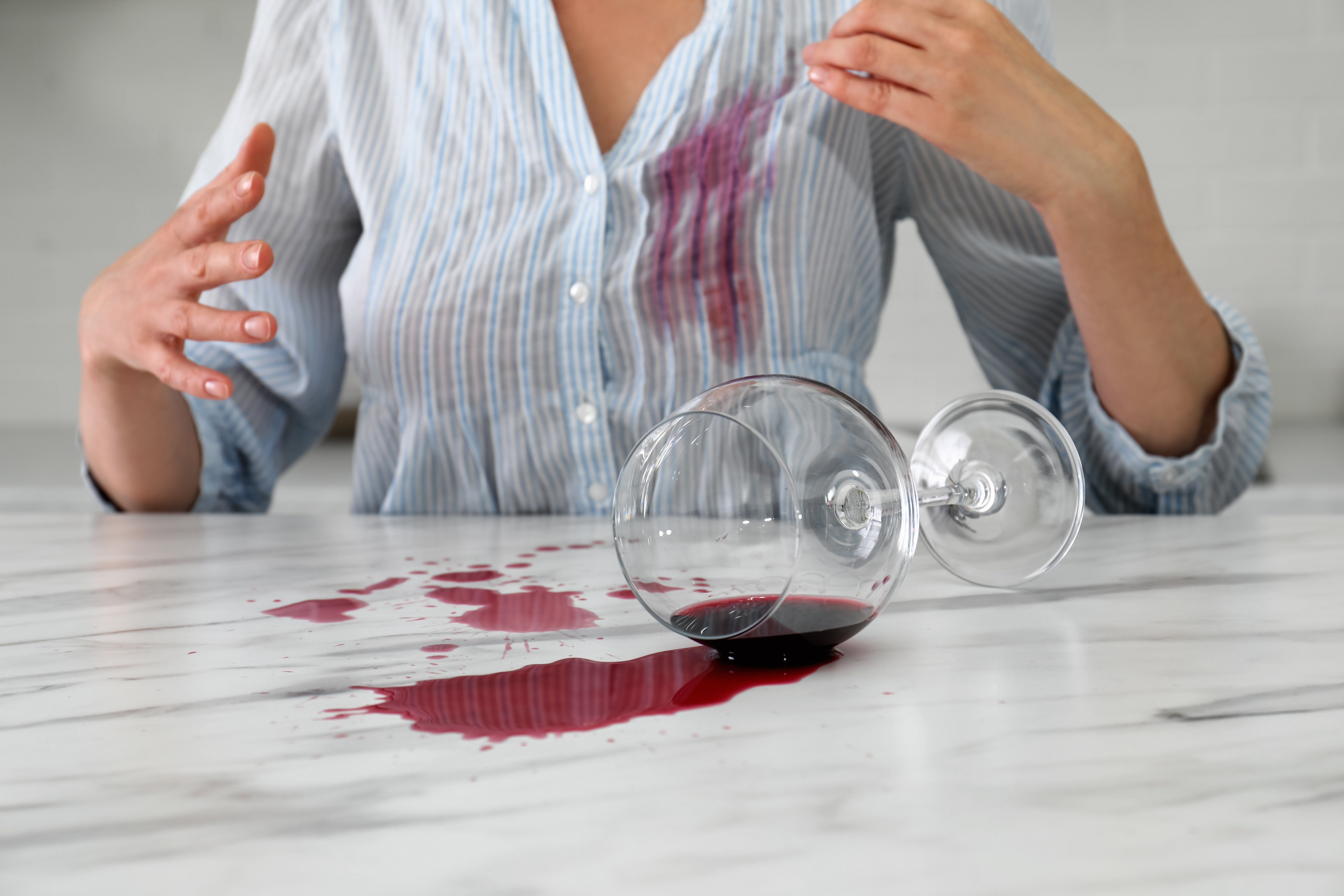 Spilled wine onto woman  | Shutterstock