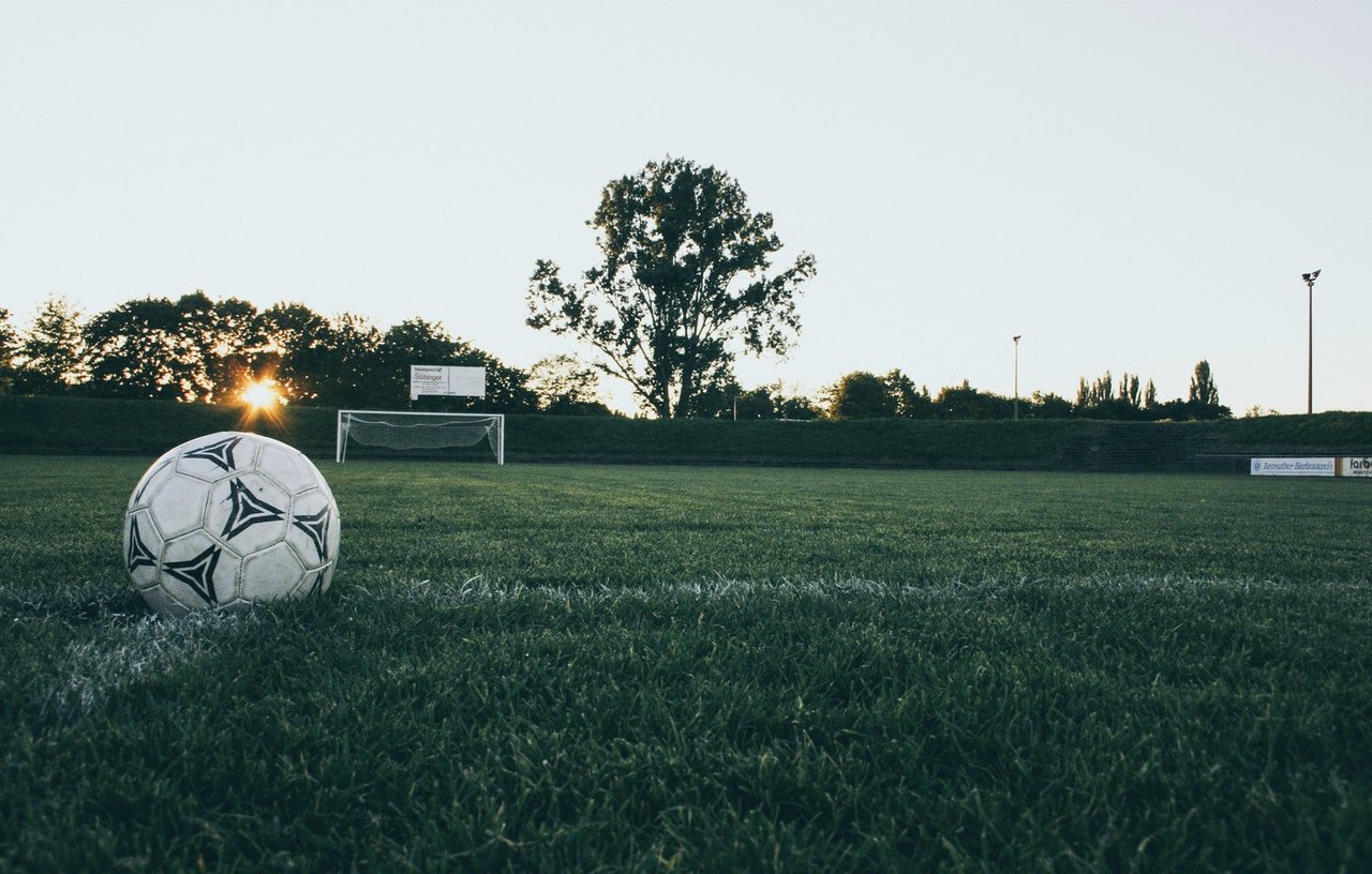 Photo of a football on a pitch | Photo: Pexels