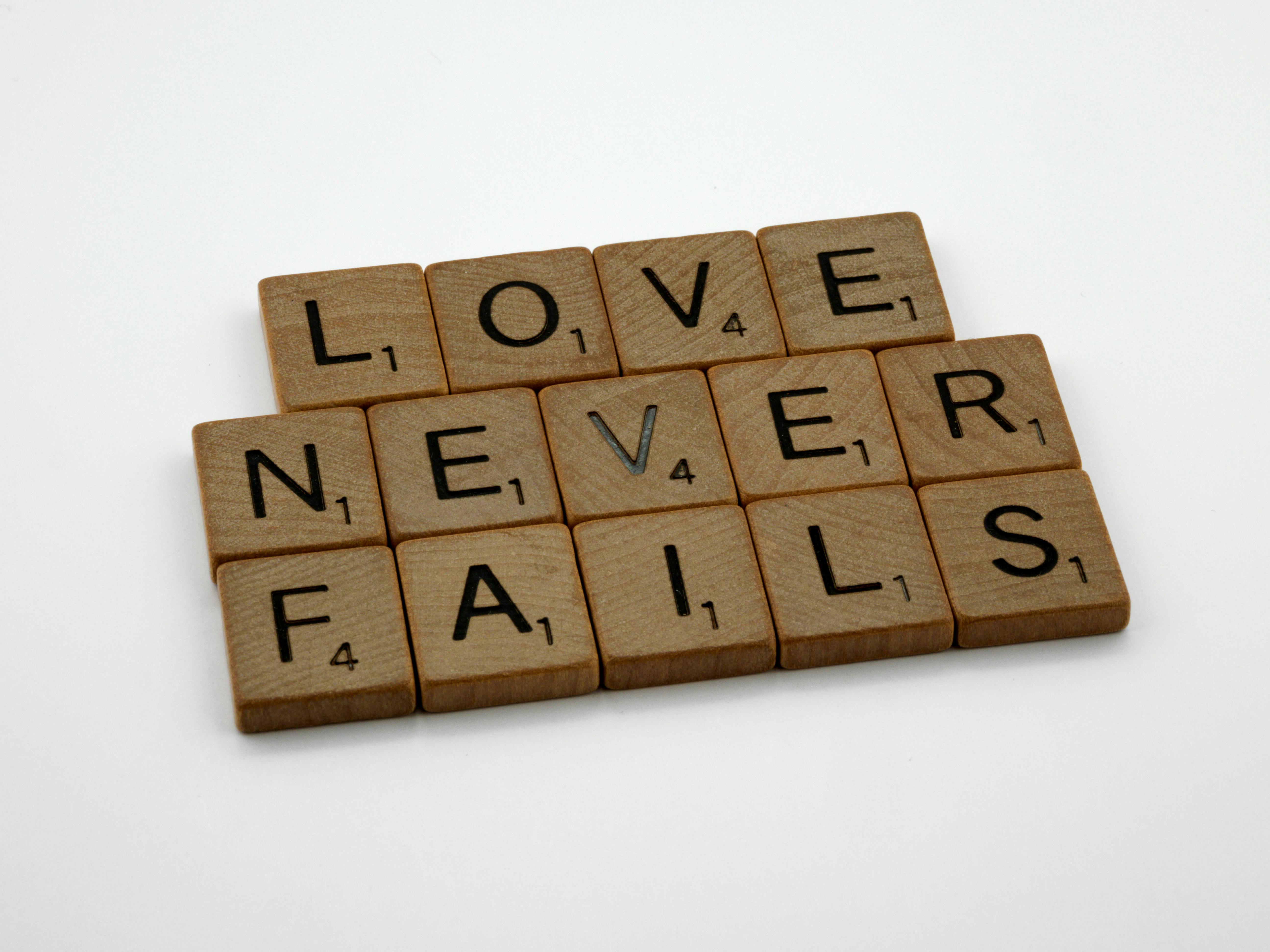 Scrabble tiles spelling out "Love Never Fails" | Source: Pexels