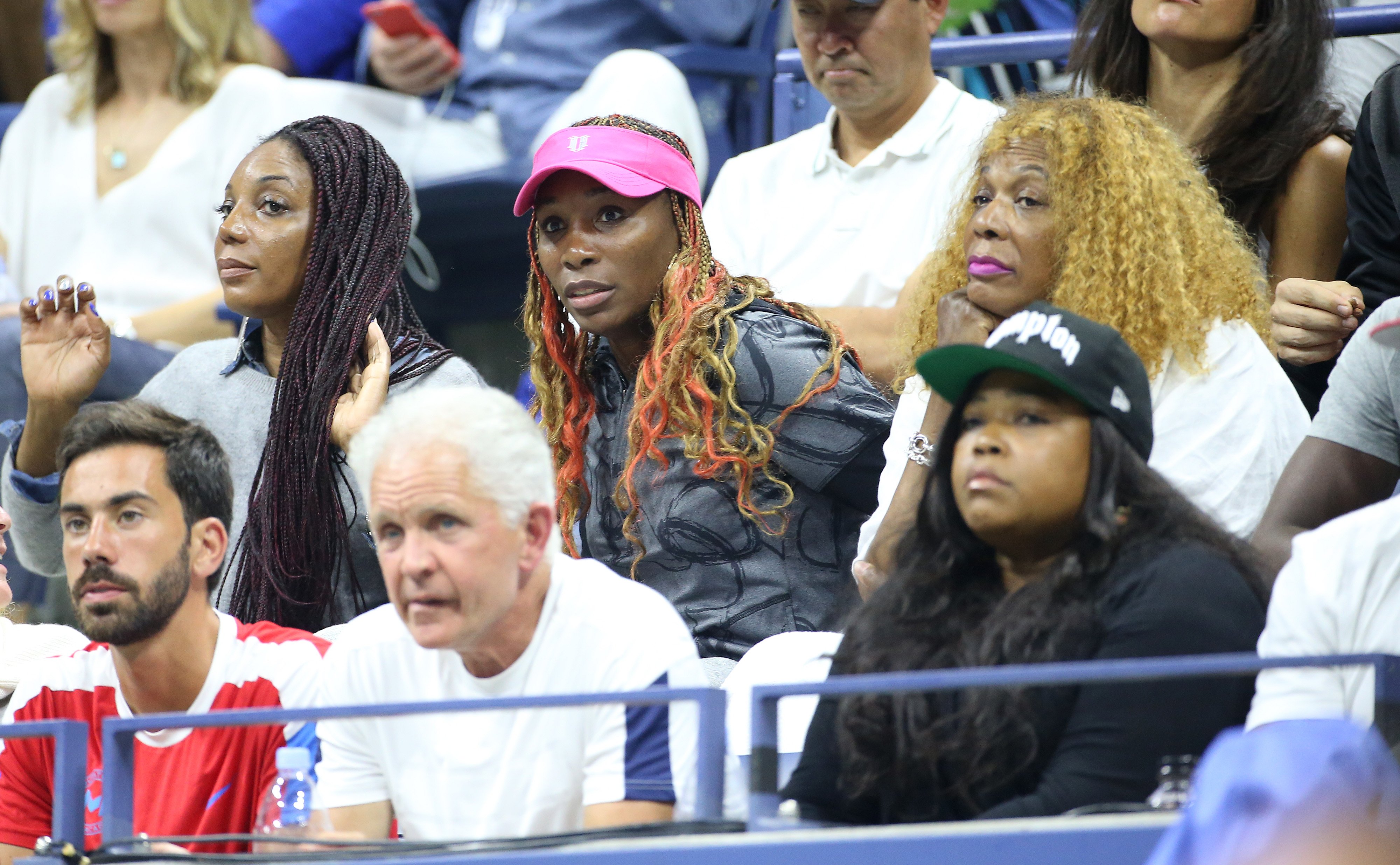 Venus Williams attends Serena's semifinal between her sisters Lyndrea Price (left), Isha Price (bottom) and their mother Oracene Price during day 11 of the 2016 US Open at USTA Billie Jean King National Tennis Center on September 8, 2016 in the Queens borough of New York City. | Source: Getty Images