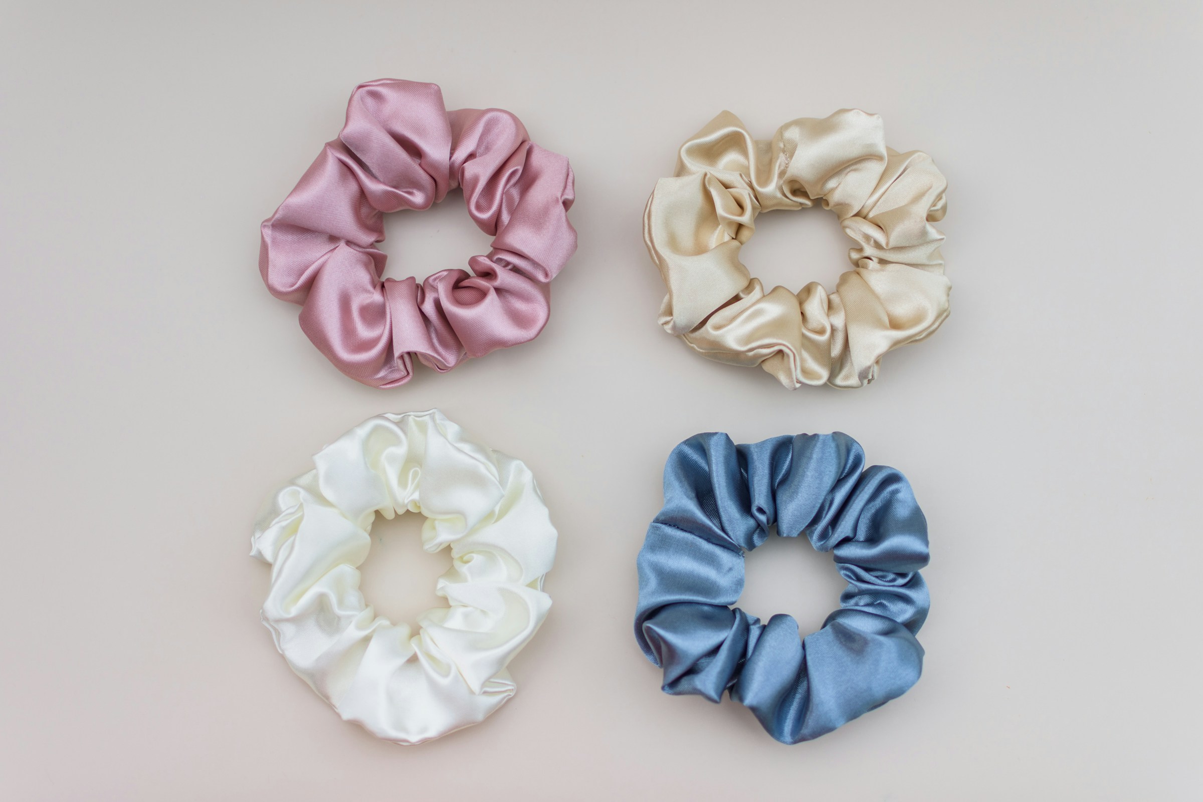Four colorful hair scrunchies | Source: Pexels