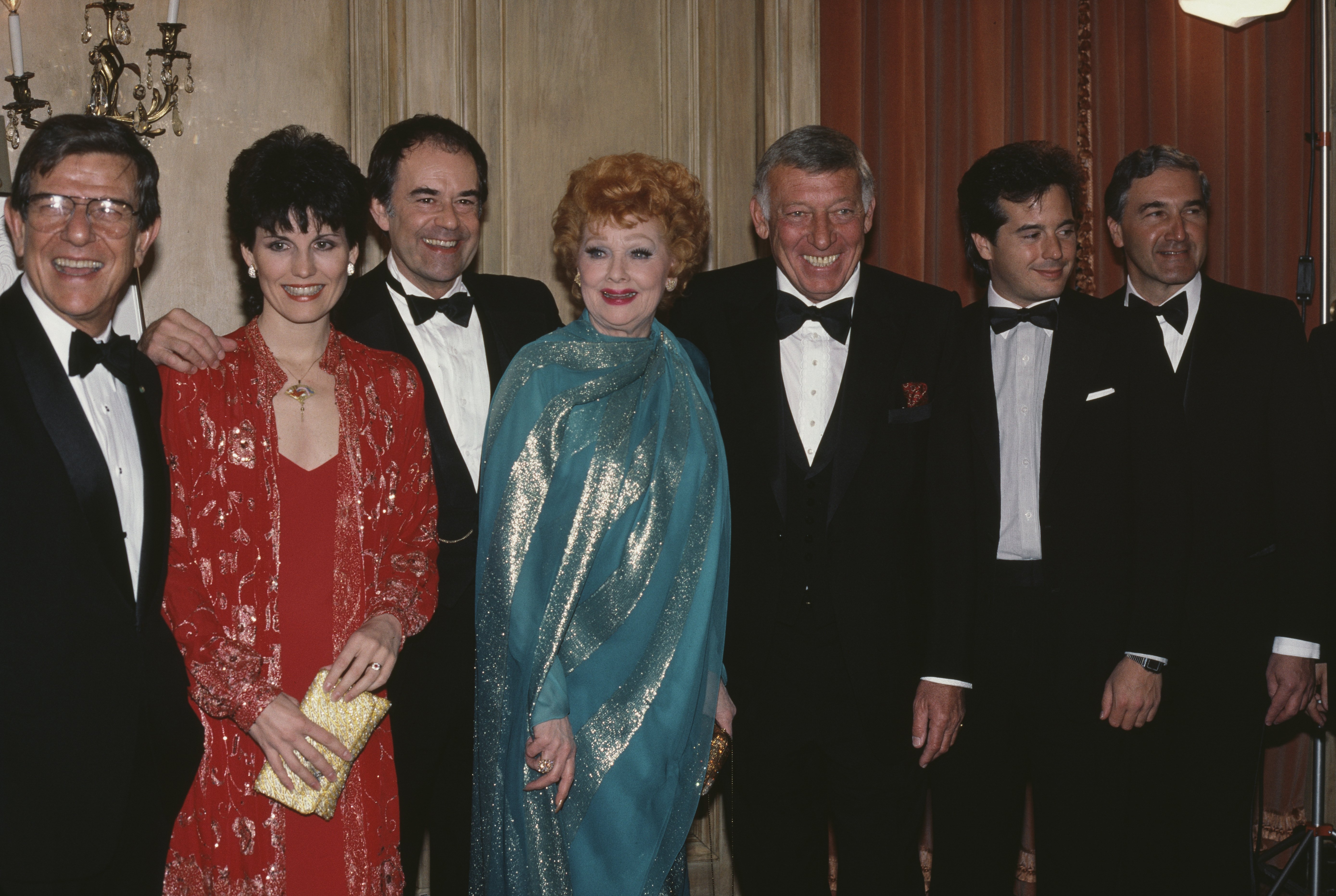 American actress and comedian Lucille Ball (1911 - 1989) with her family during a tribute to her by the Museum of Broadcasting in New York City, April 1984 | Source: Getty Images