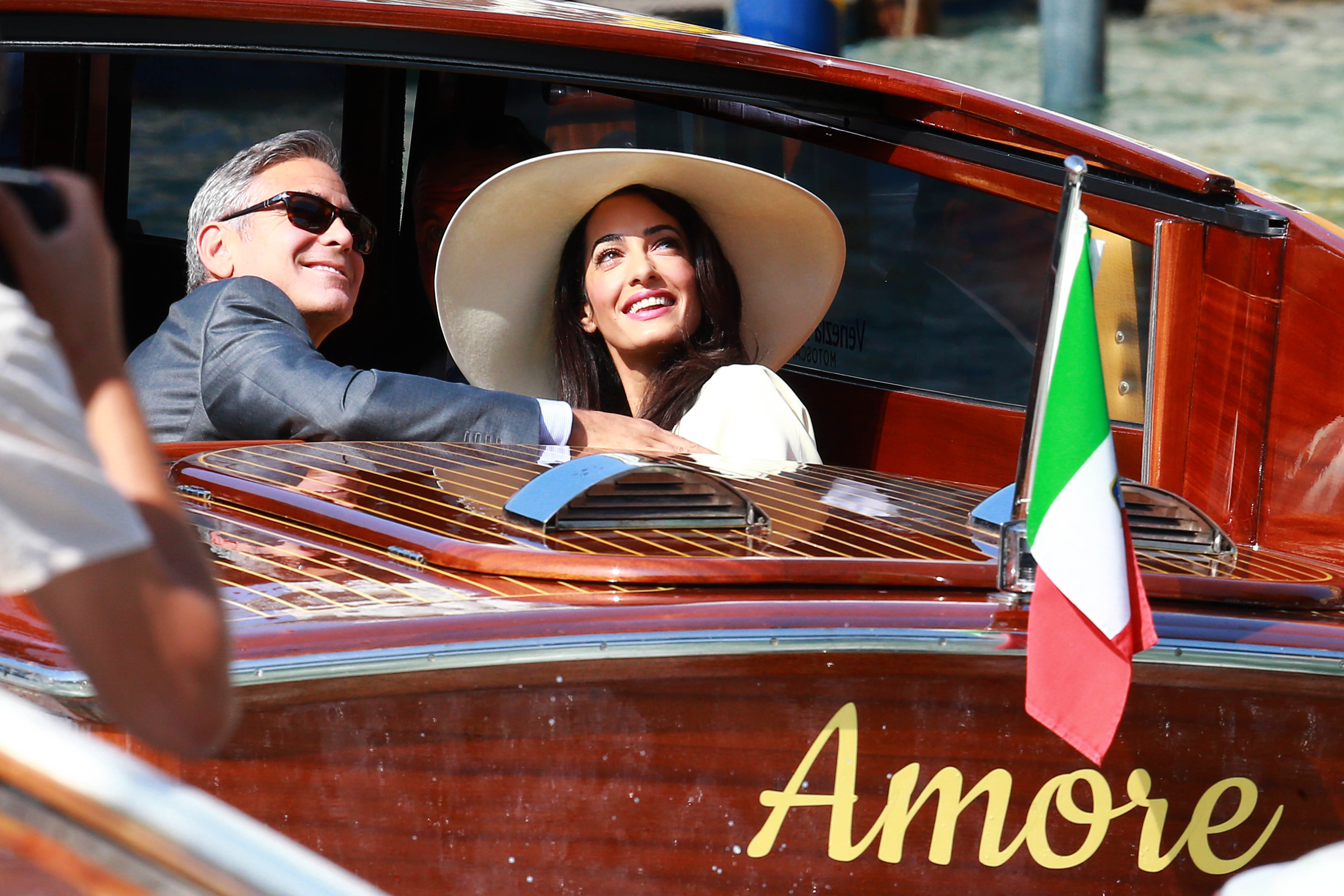 George Clooney and Amal Clooney  sighted on the way to their civil wedding at Canal Grande on September 29, 2014, in Venice, Italy. | Source: Getty Images