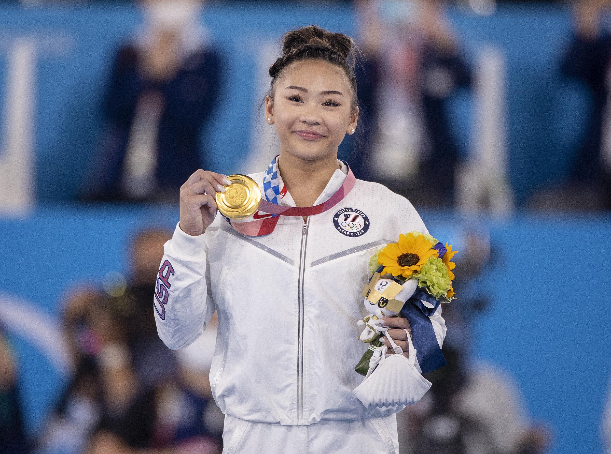 Suni Lee on the podium with her gold medal after winning the all-around final during the Tokyo 2020 Summer Olympic Games on July 29, 2021, in Tokyo, Japan. | Source: Getty Images