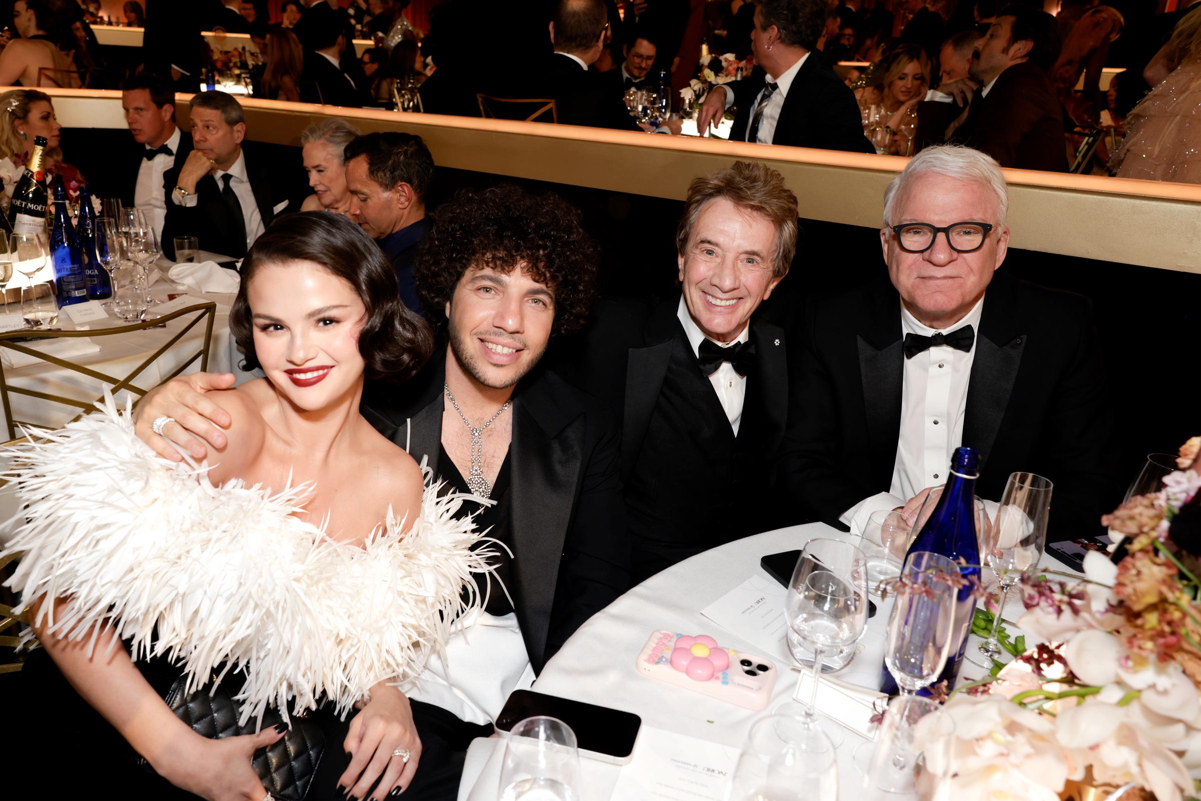 Selena Gomez, Benny Blanco, Martin Short, and Steve Martin pose together with glowing smiles, their table radiating star power and fun during the event.