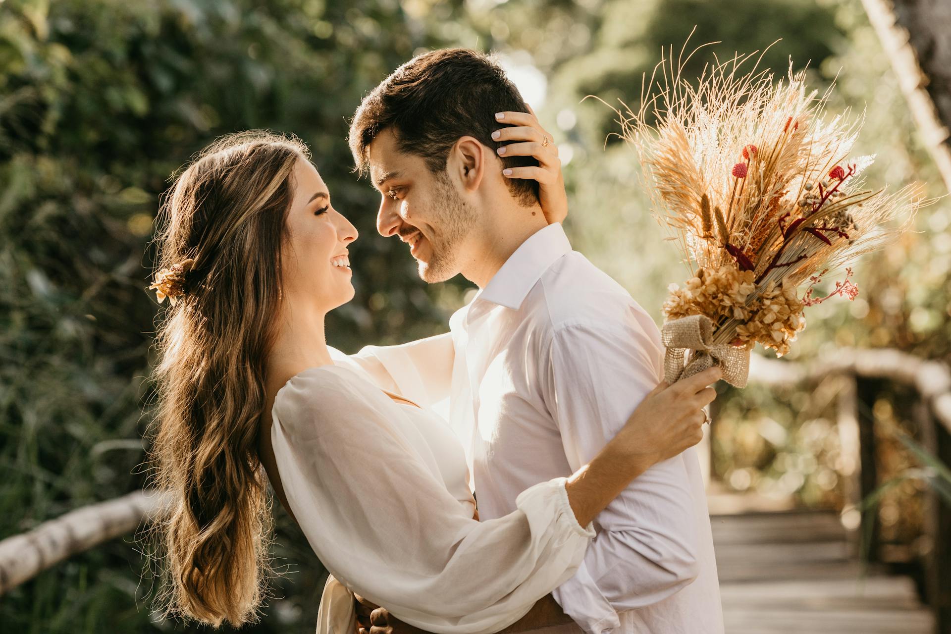A bride and groom embracing outdoors | Source: Pexels