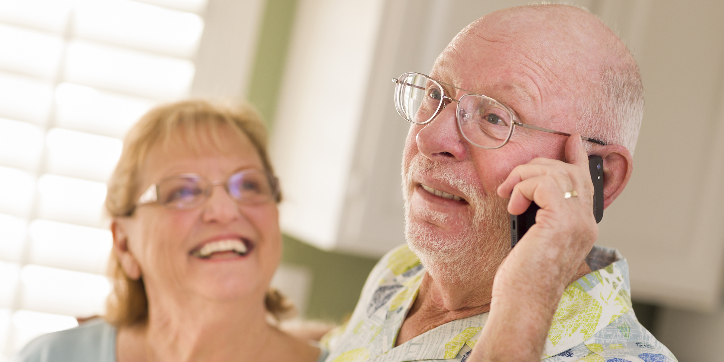 An elderly man on the phone | Source: Shutterstock