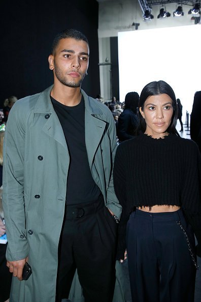Kourtney Kardashian (L) and her companion Younes Bendjima (R) attend the Haider Ackermann show as part of the Paris Fashion Week Womenswear Spring/Summer 2018 on September 30, 2017 in Paris, France | Photo: Getty Images