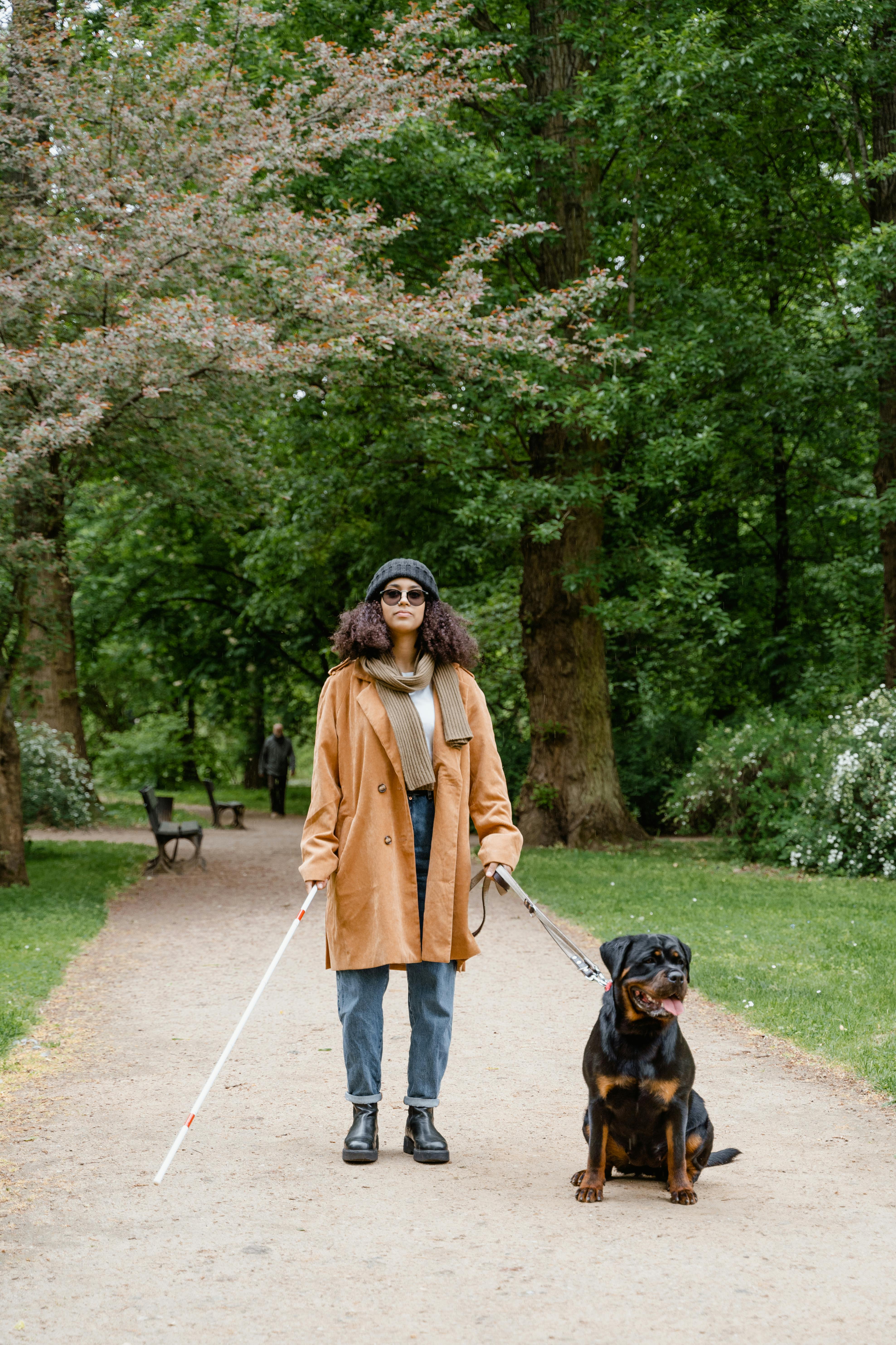 A blind woman with a Rottweiler | Source: Pexels
