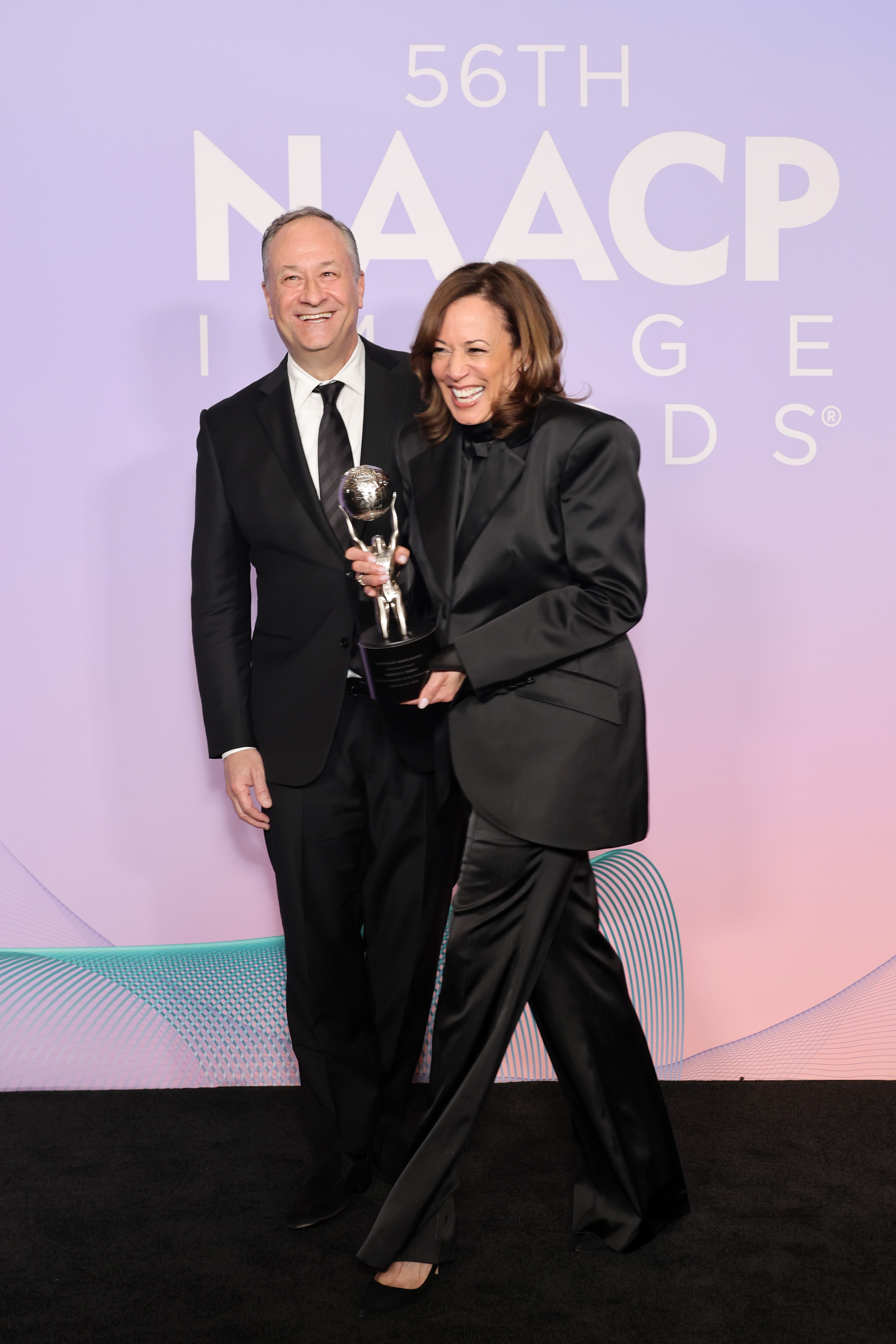 Doug Emhoff and Kamala Harris pose in the press room at the 56th NAACP Image Awards | Source: Getty Images