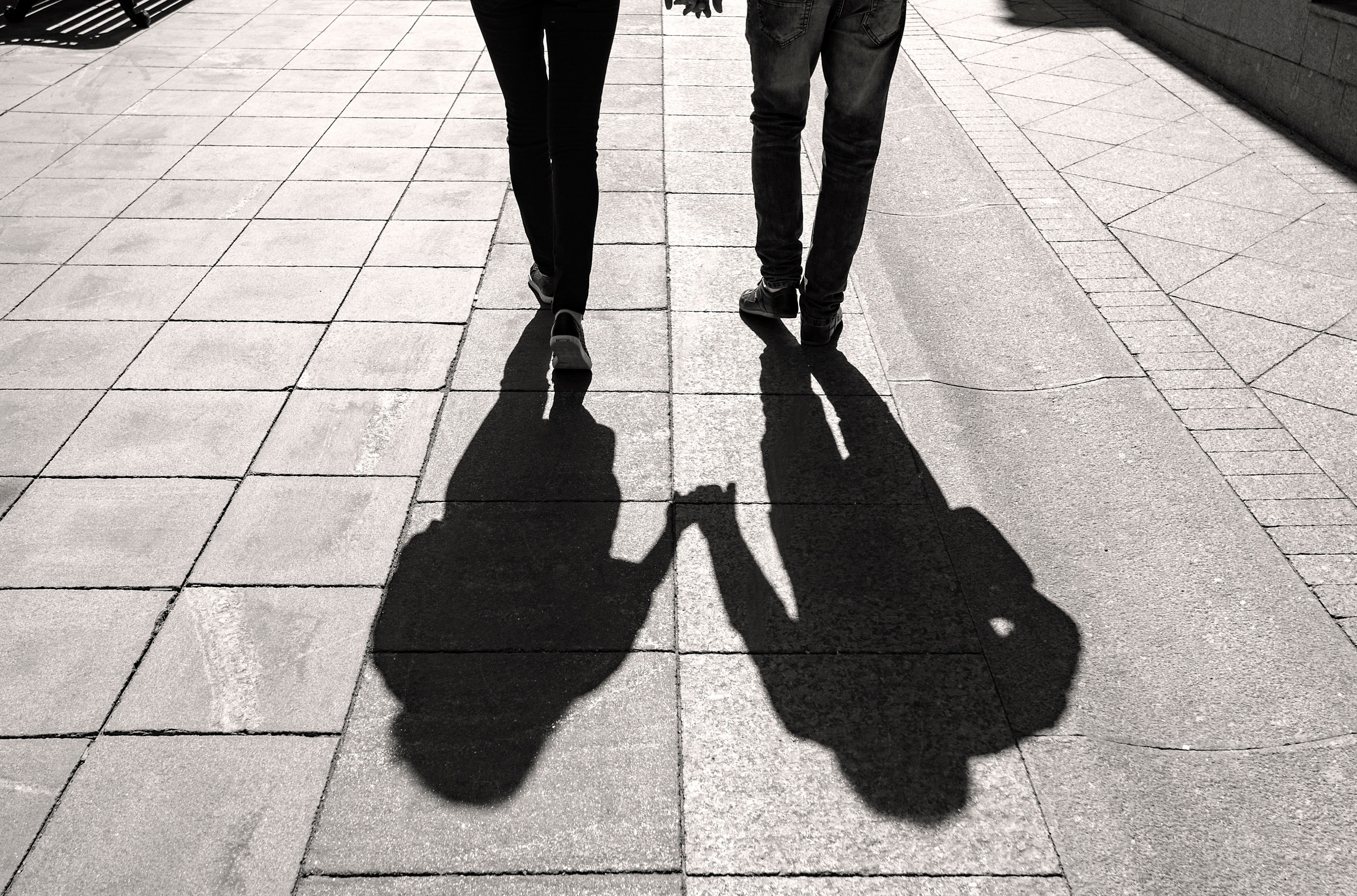 Shadows of a couple walking | Source: Shutterstock