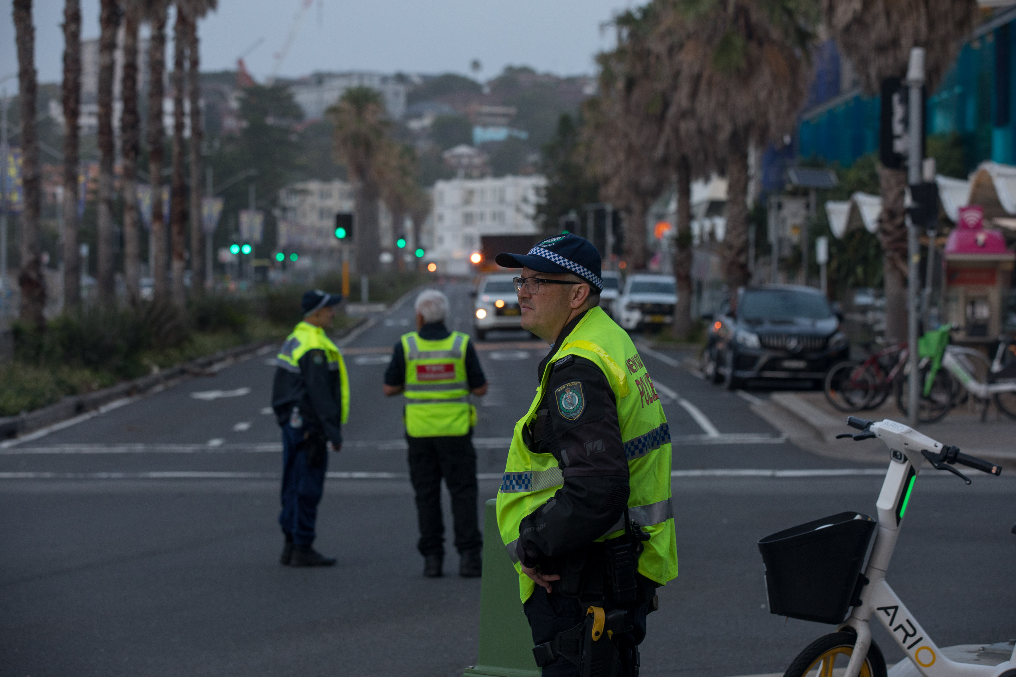 Police officers stand guard at a cordoned-off street near Bondi Beach in Sydney after the mass shooting on December 15, 2025 | Source: Getty Images