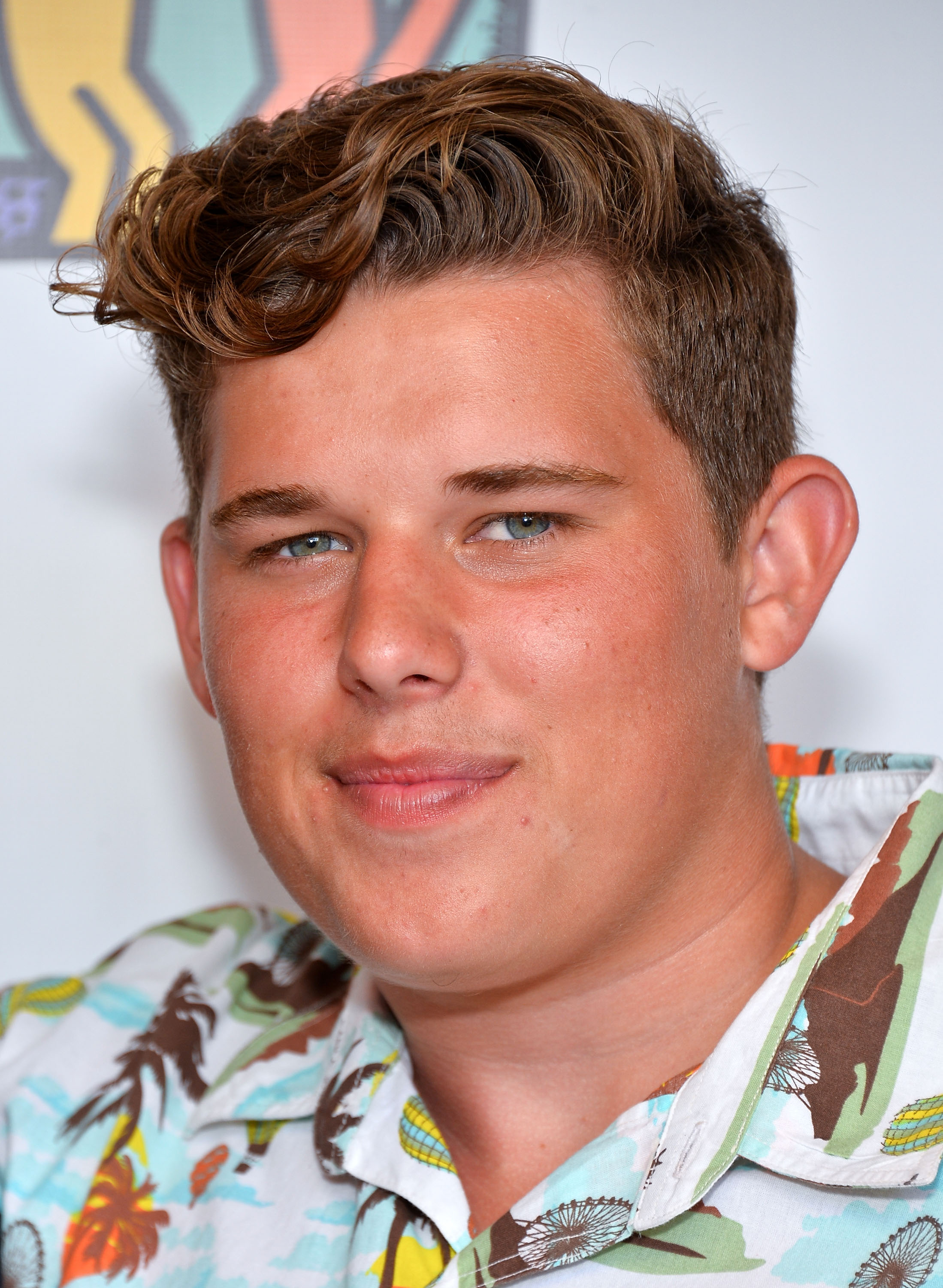Also from the Team Maria event, Christopher poses for a close-up photo. His face appears fuller, with neatly groomed hair and a soft expression highlighting his features during his teenage years.