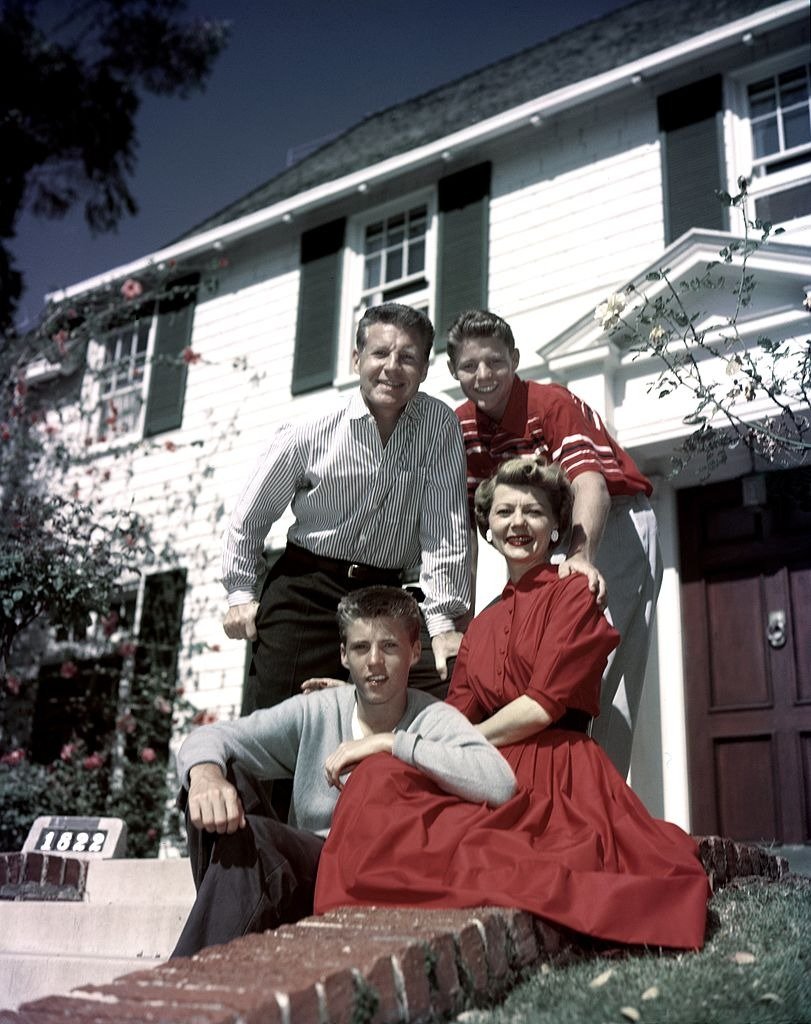   Actors and real life family The Nelsons pose outside their house circa 1955 in Los Angeles, California | Photo: Getty Images