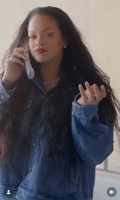 Rihanna listening to someone on the phone in her new video dated February 23, 2026 | Source: Instagram/badgalriri