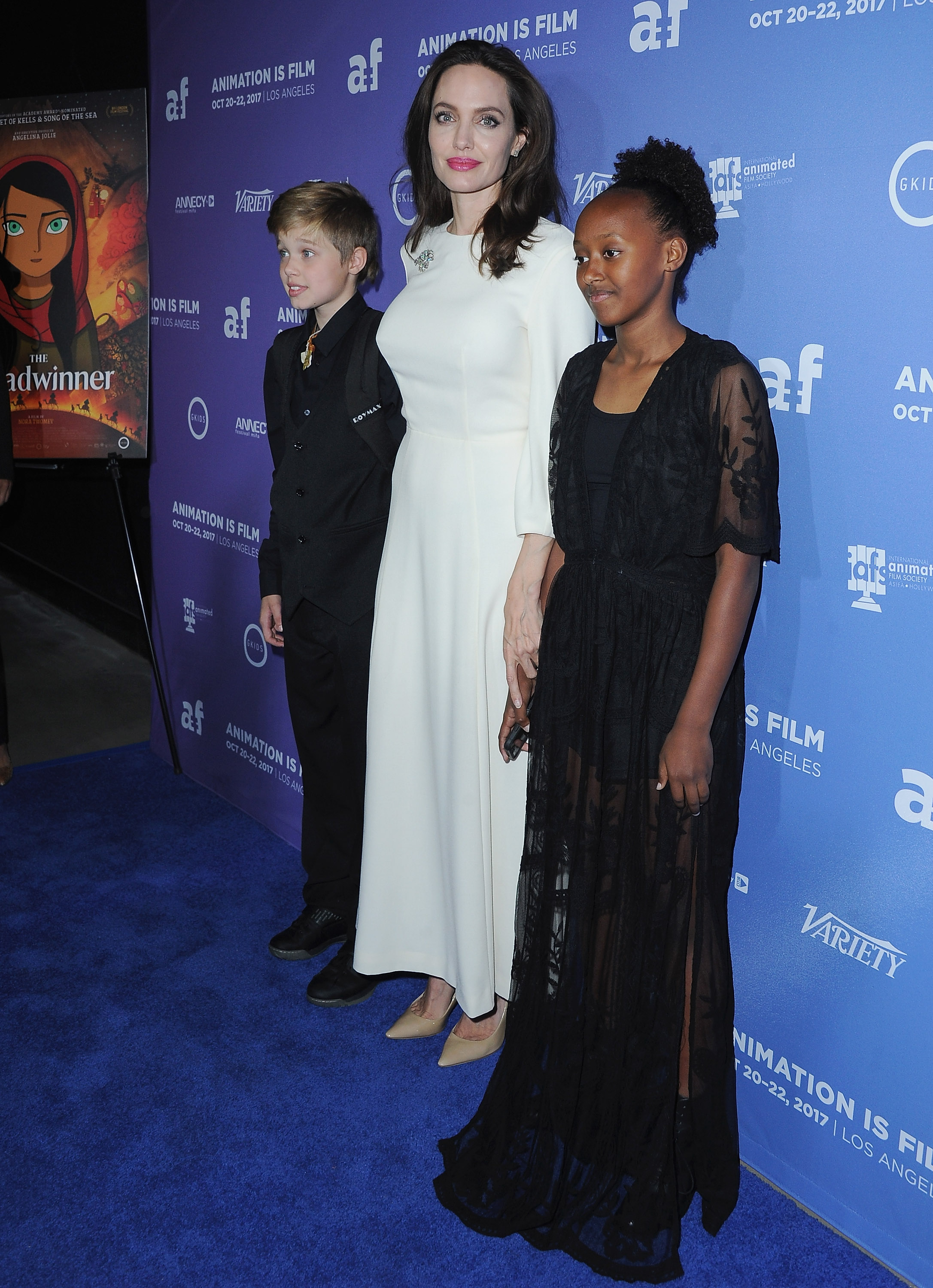 Shiloh Jolie-Pitt, Angelina Jolie and Zahara Jolie-Pitt arrive at the premiere of Gkids' "The Breadwinner" at TCL Chinese 6 Theatres on October 20, 2017 in Hollywood, California. | Source: Getty Images