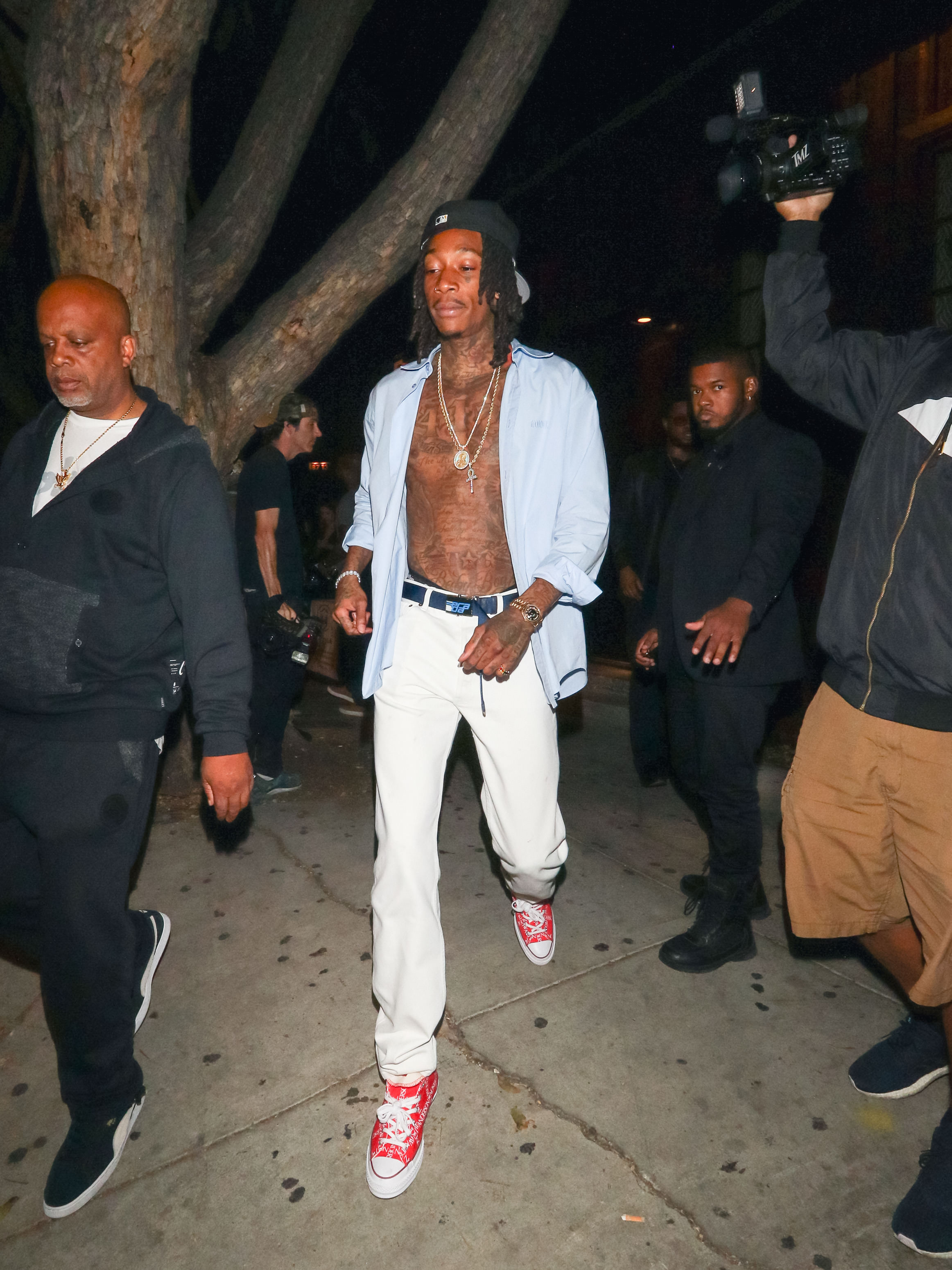 By September 23, 2018, Wiz Khalifa's physical transformation was impossible to ignore. Photographed in Los Angeles, California, the rapper appeared noticeably more muscular after adding roughly 35 pounds through years of dedicated MMA training, marking a dramatic departure from the lean frame that defined his early career.