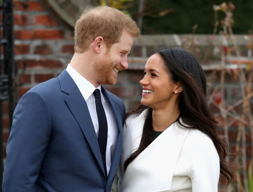 Prince Harry and Meghan Markle during an official photocall to announce the engagement of Prince Harry and actress Meghan Markle at The Sunken Gardens at Kensington Palace in London, England | Photo: Getty Images