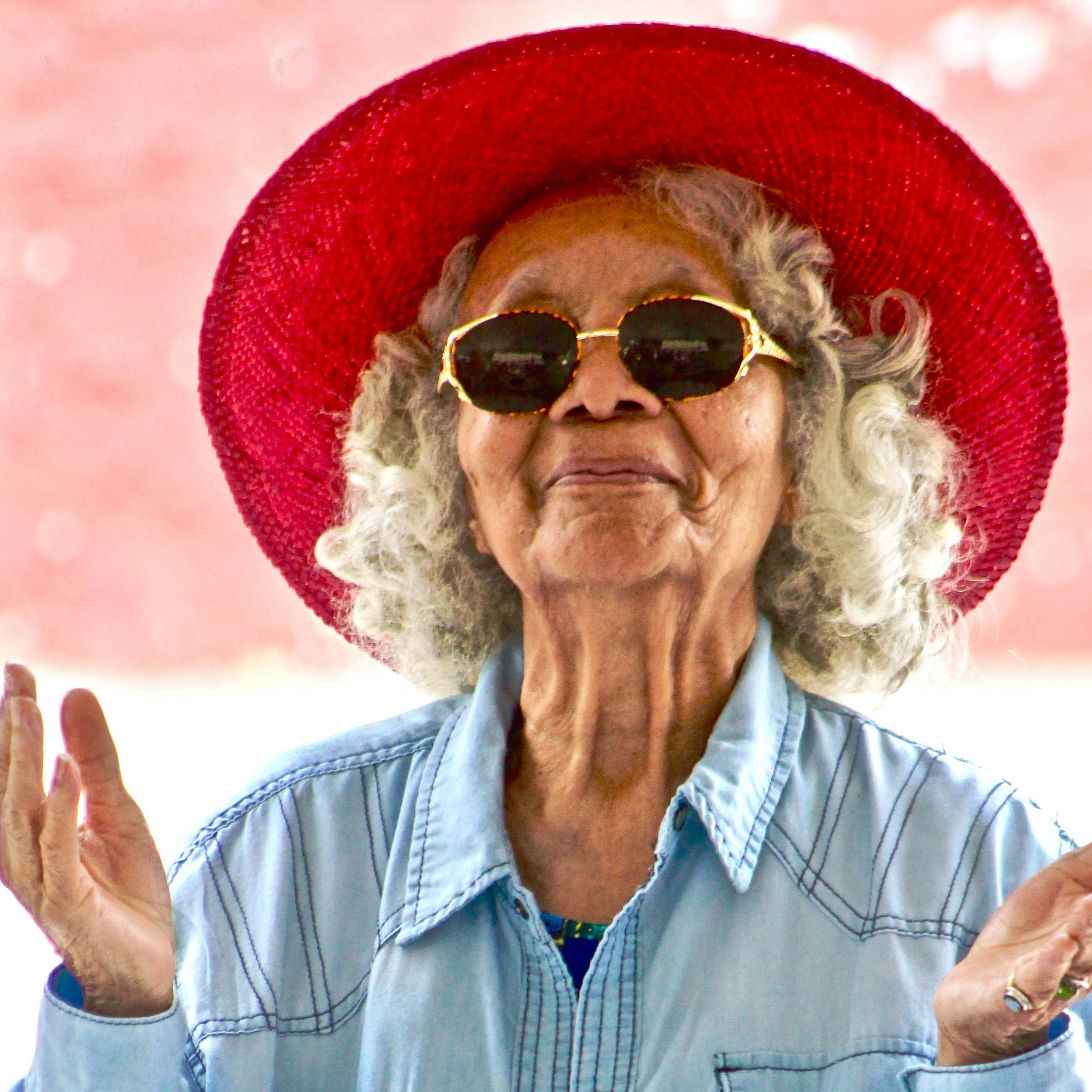 An elderly woman smiling happily | Source: Pexels