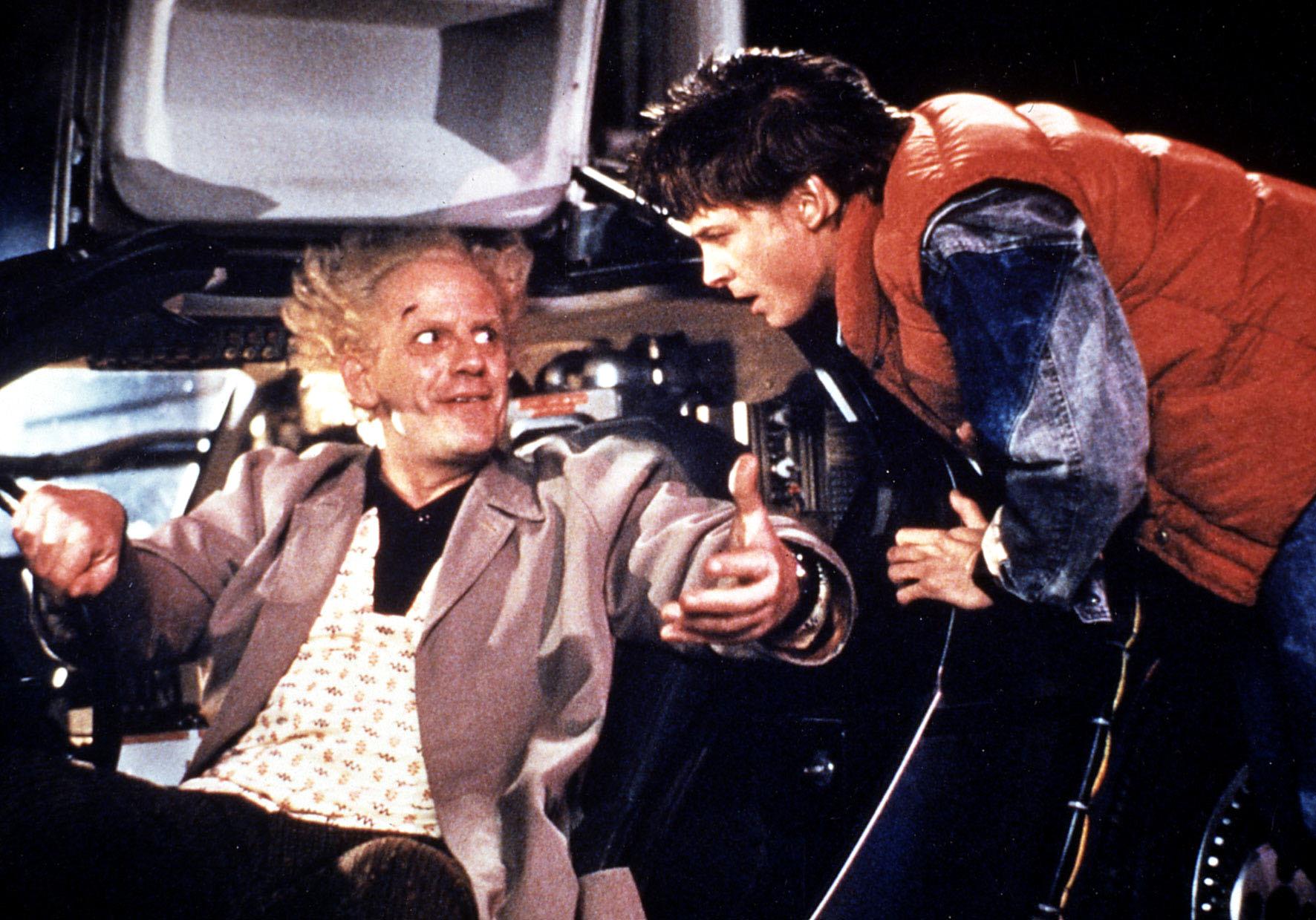 Michael J. Fox and Christopher Lloyd on the set of "Back to the Future" in 1984 | Source: Getty Images