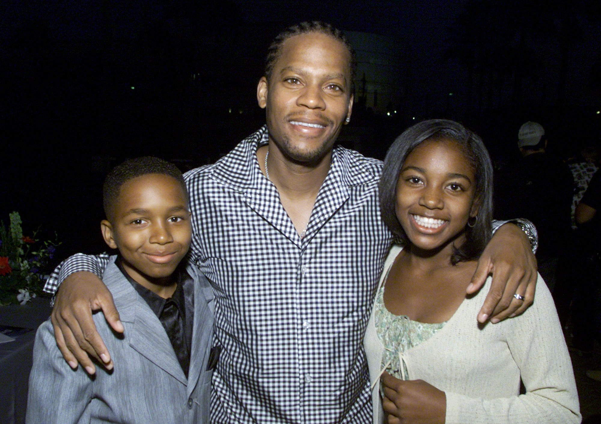 Stars of "The Hughleys," Dee Jay Daniels, D.L. Hughley and Ashley Monique Clark at UPN's summer tour party for the Television Critics Association at Paramount Studios in Los Angeles, Ca. on July 16, 2001. | Source: Getty Images