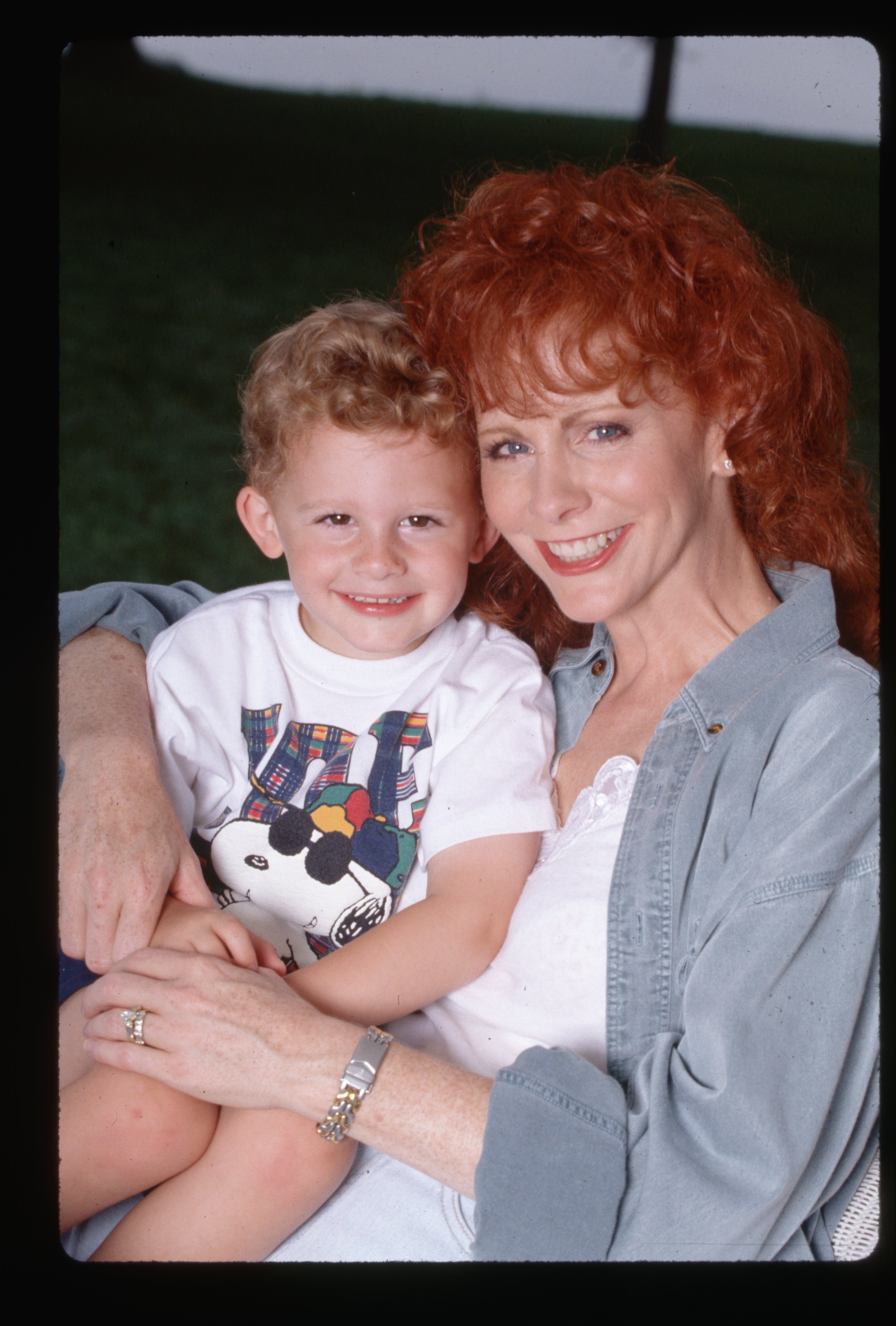 Country singer Reba McEntire hugs her young son Shelby circa 1994 | Source: Getty Images 