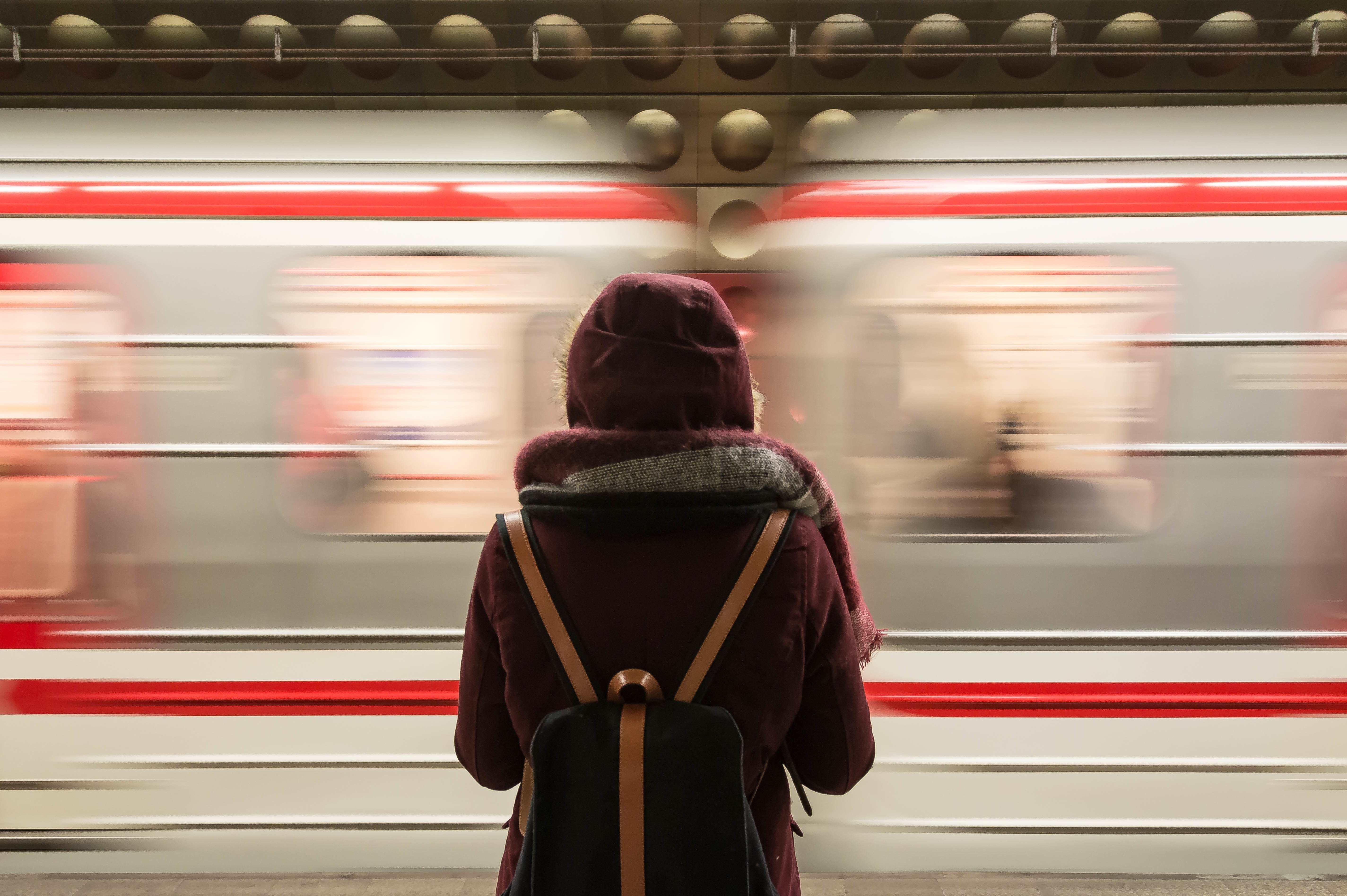 A lady at a train station | Photo: Pexels