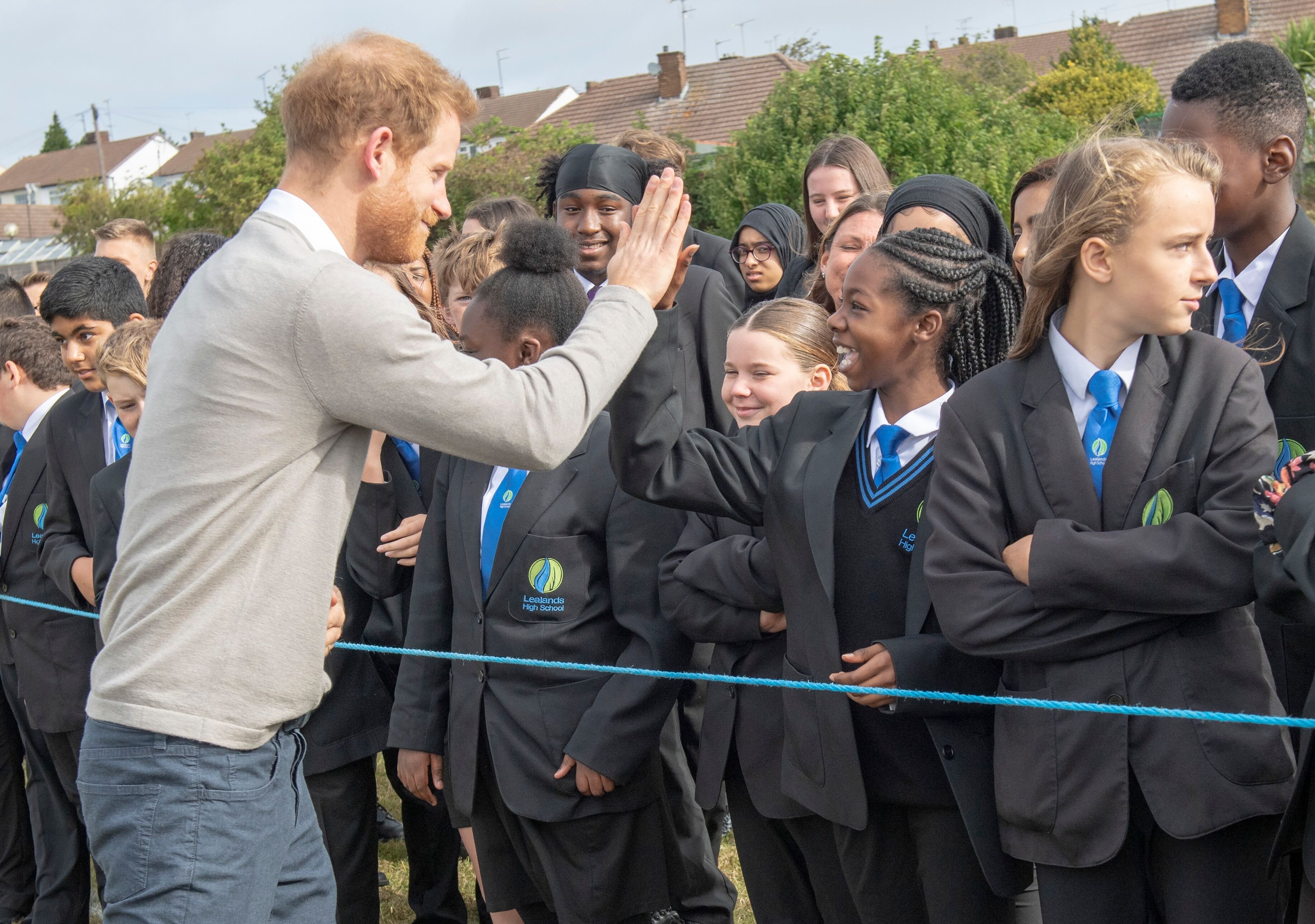 Prince Harry meets pupils during his visit to The Rugby Football Union All Schools Programme. | Source: Getty Images