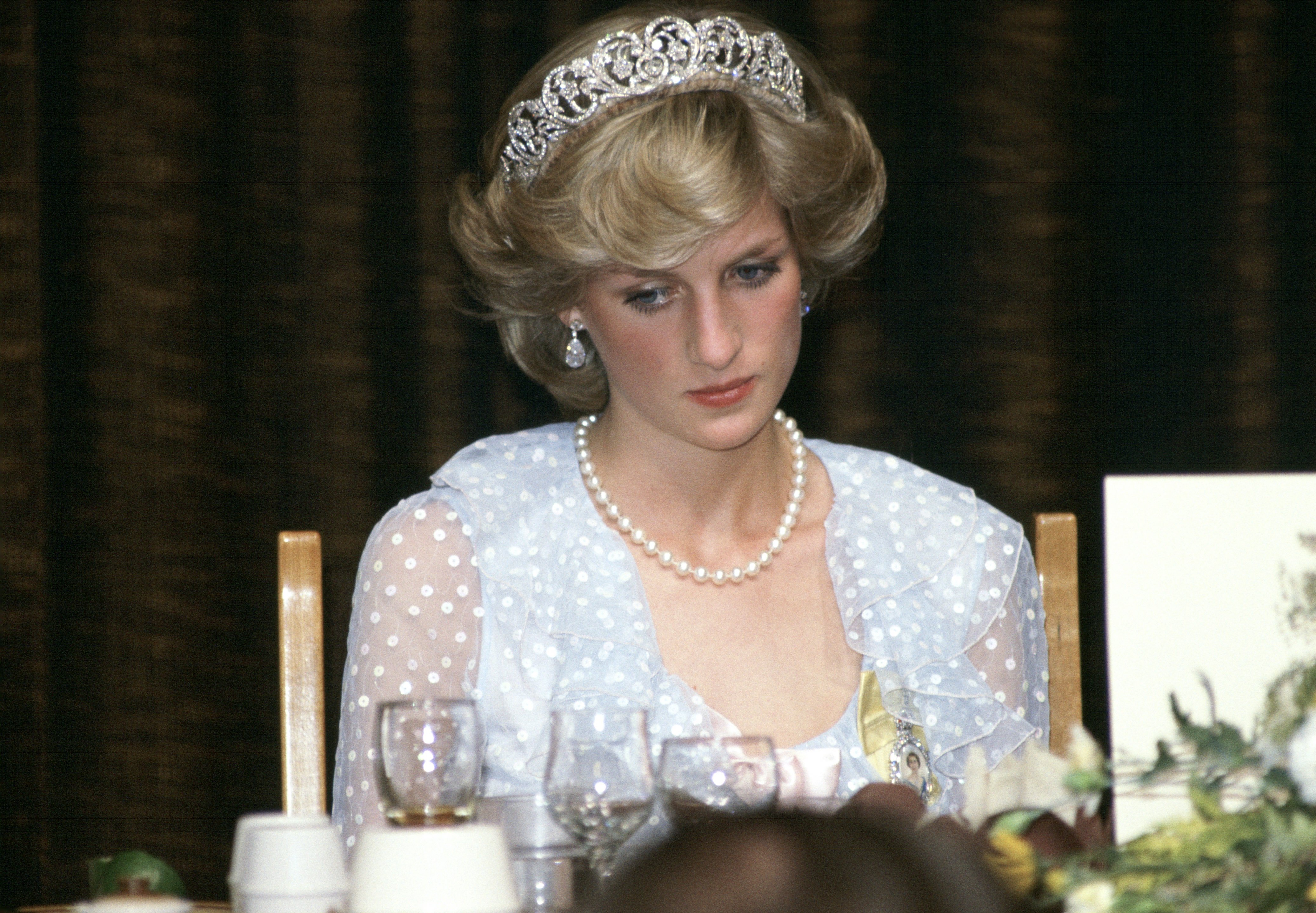 Princess Diana at a banquet in New Zealand wearing a blue chiffon evening dress designed by fashion designers David and Elizabeth Emanuel (the Emanuels) | Photo: Getty Images