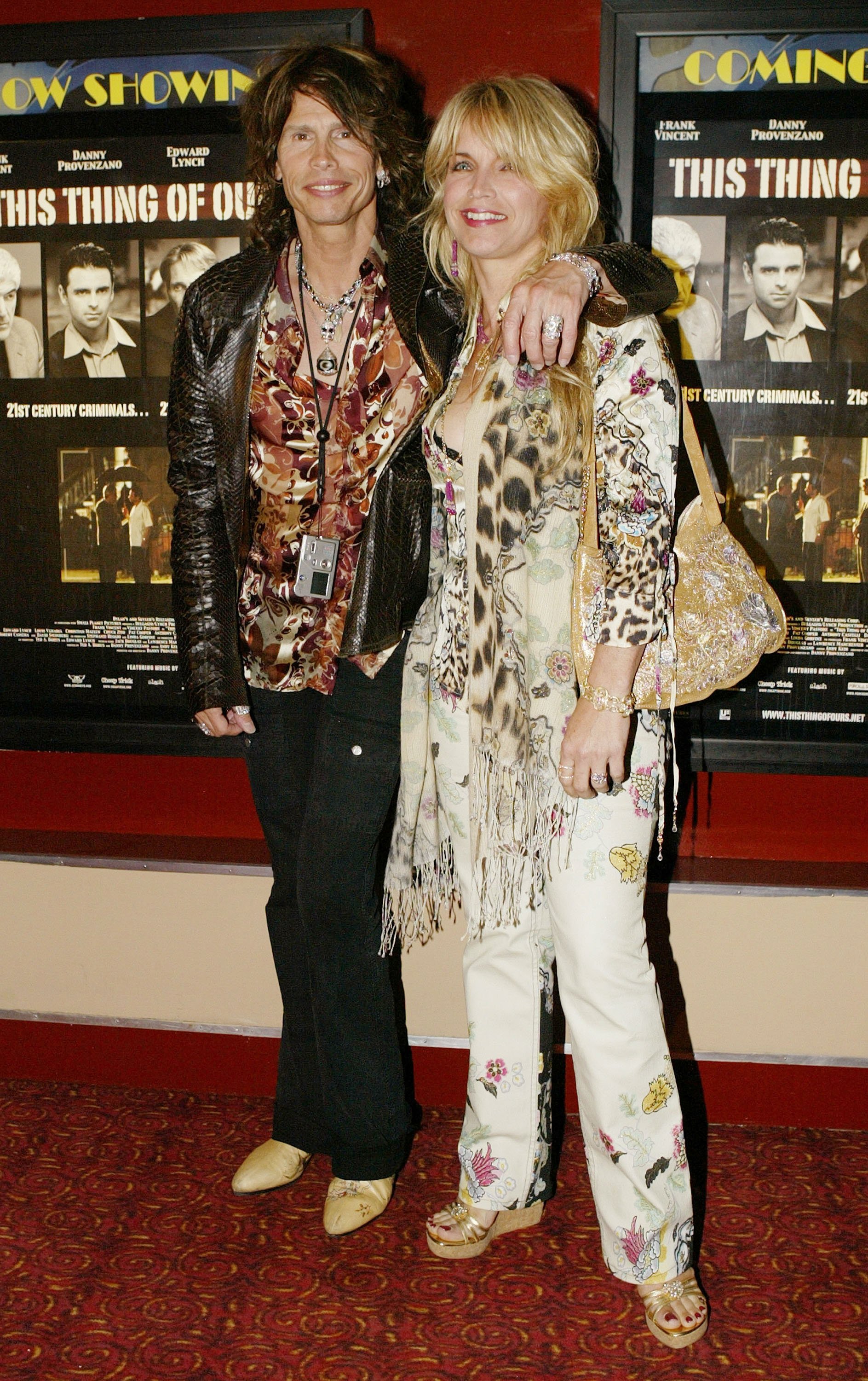 Steven Tyler and Teresa Barrick pose for a photo at the premiere of "This Thing of Ours" at the Village East Cinema July 16, 2003, in New York City | Source: Getty Images