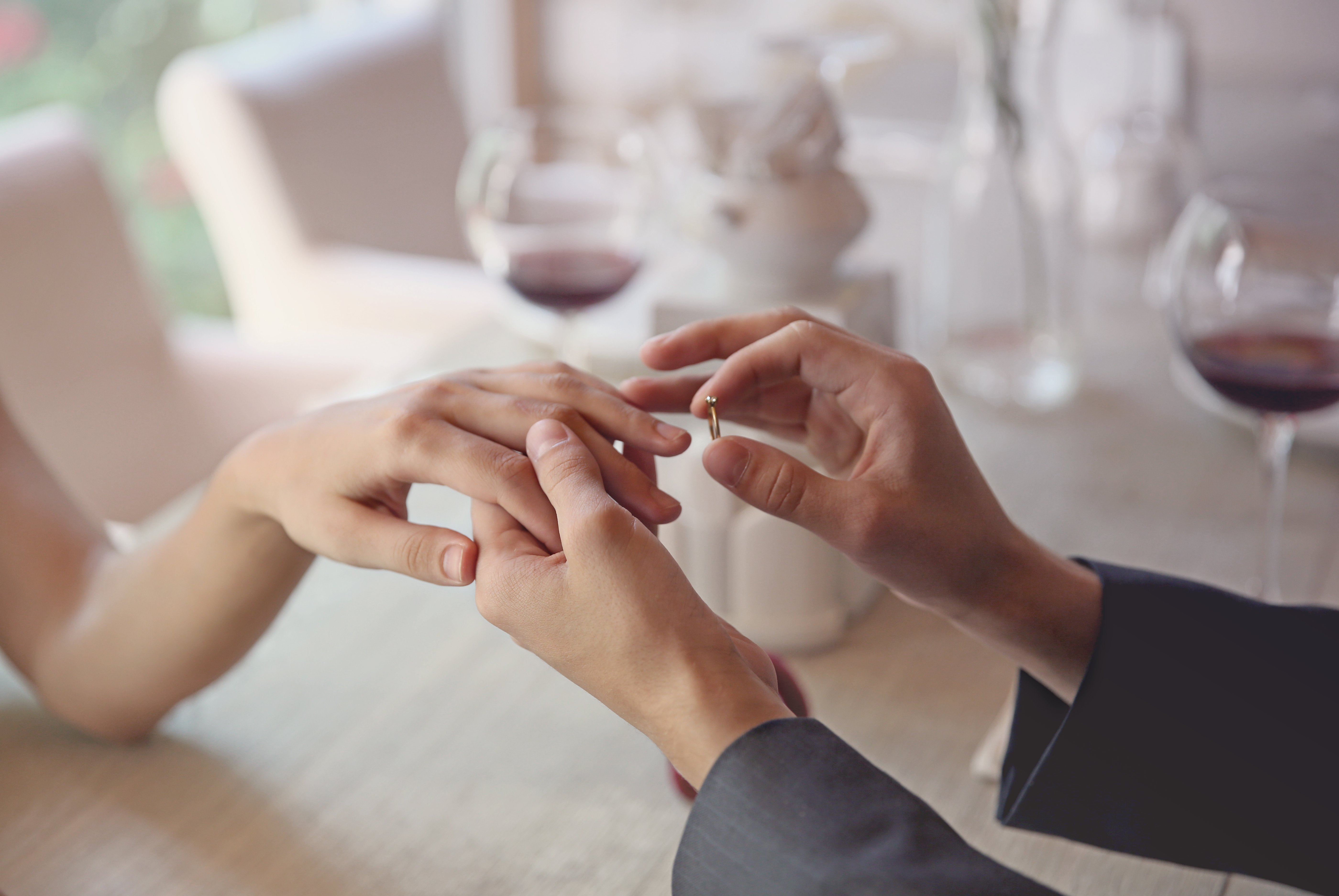 A man places a ring on a woman's finger. | Source: Shutterstock 