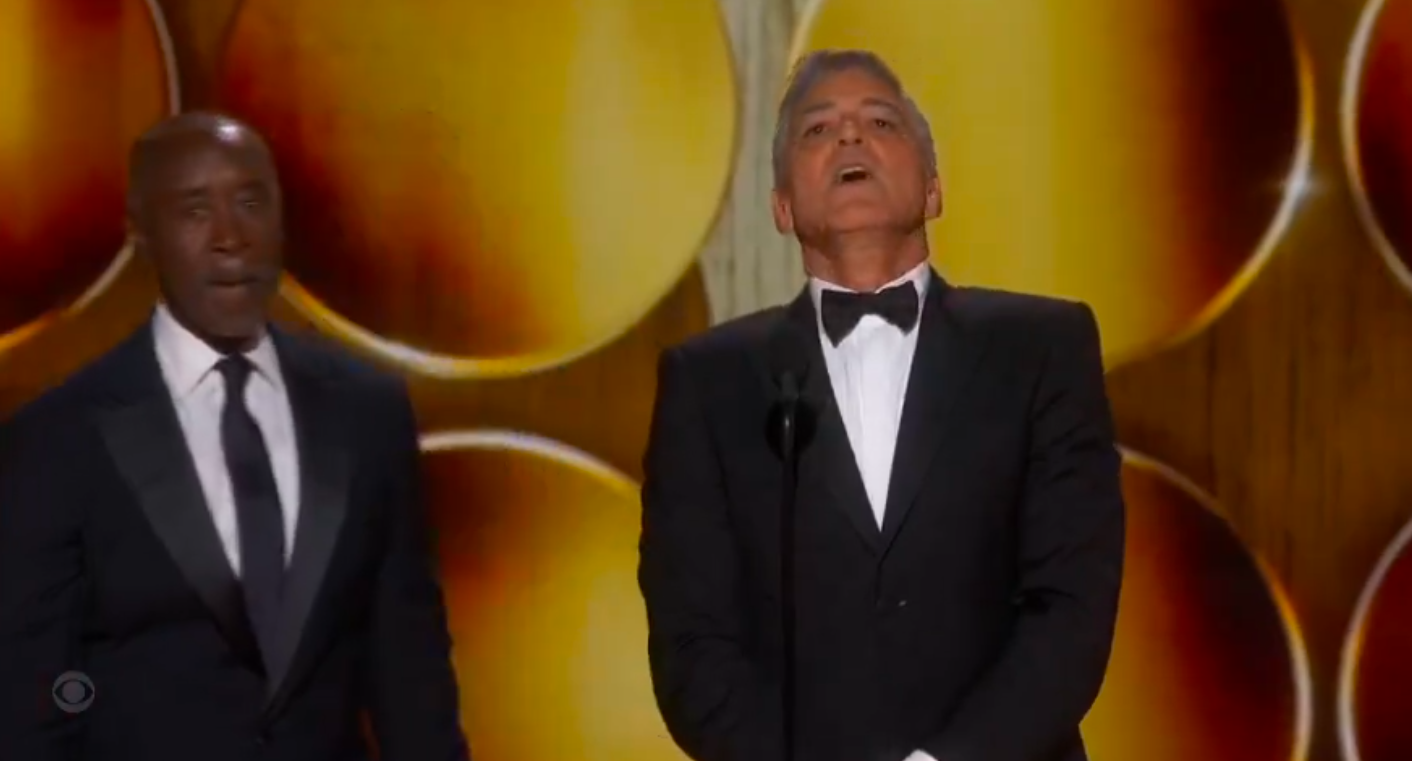 George Clooney reacting after Don Cheadle slapped his backside. | Source: X/@SpencerAlthouse