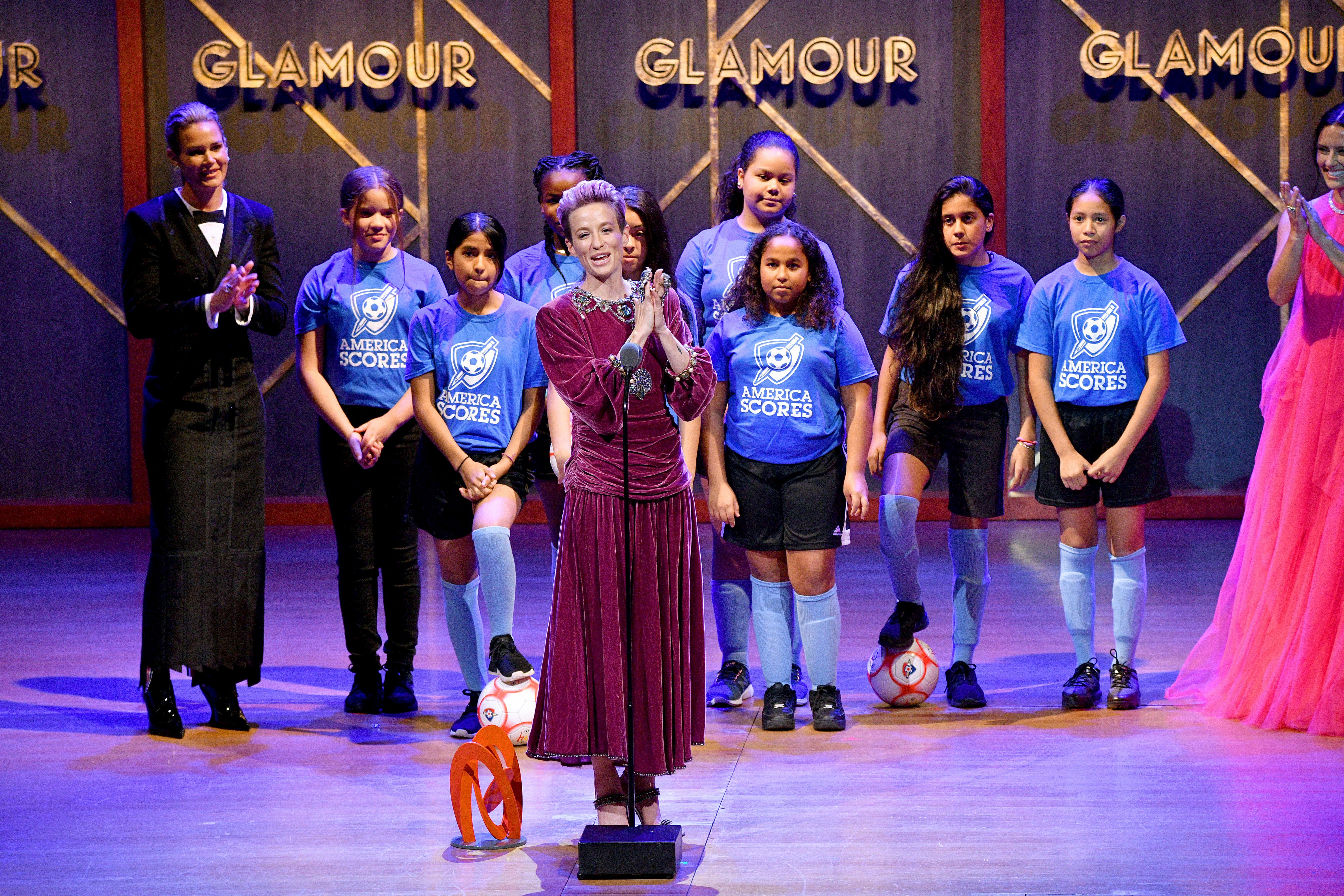 Megan Rapinoe speaks onstage alongside the Mott Hall Girls soccer team at the 2019 Glamour Women Of The Year Awards at Alice Tully Hall on November 11, 2019, in New York City. | Source: Getty Images.