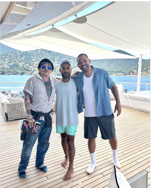 Johnny Depp, Will Smith, and Egyptian singer Ahmed Saad on a yacht in Italy, dated July 17, 2024 | Source: Instagram/ahmedsaadofficial