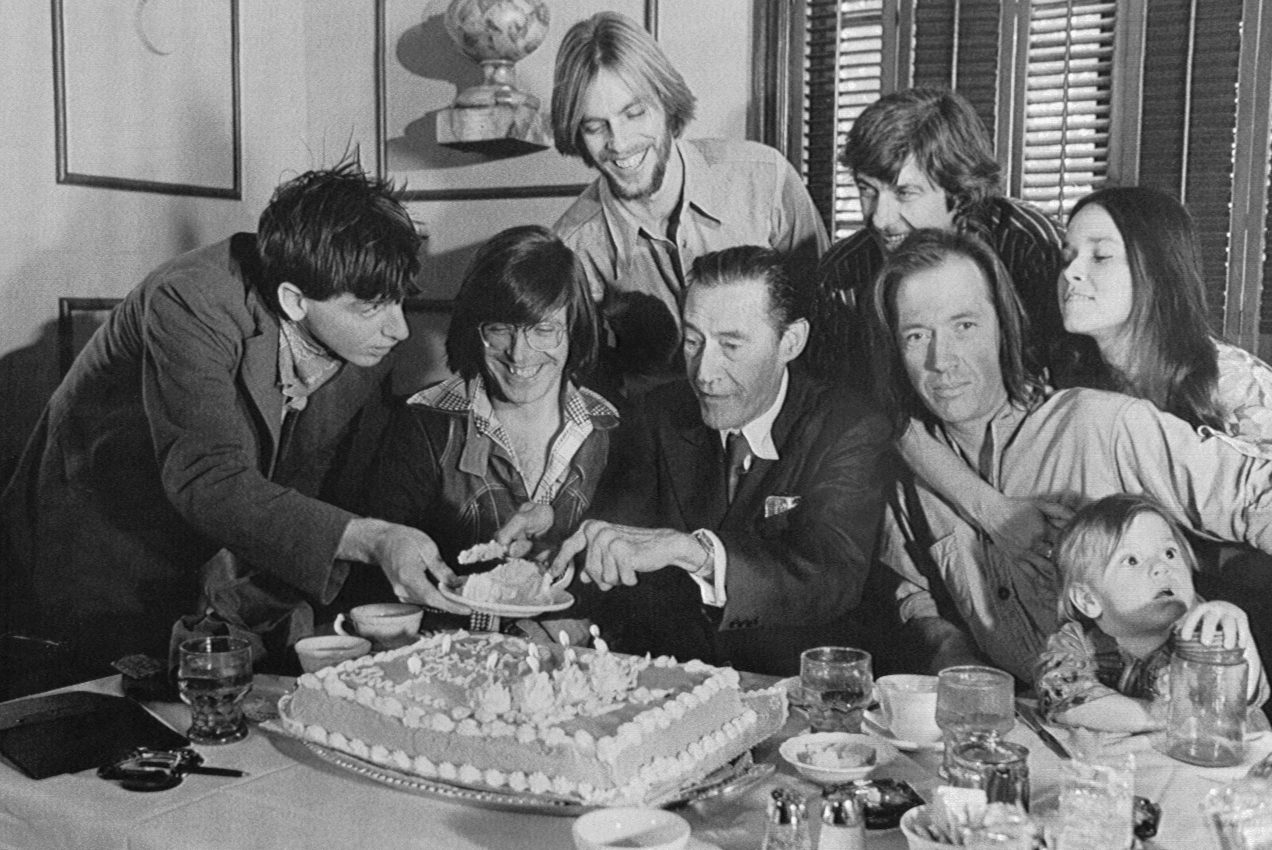 John Carradine (C) is pictured as he holds a reunion with his family to celebrate his 68th birthday | Source: Getty Images