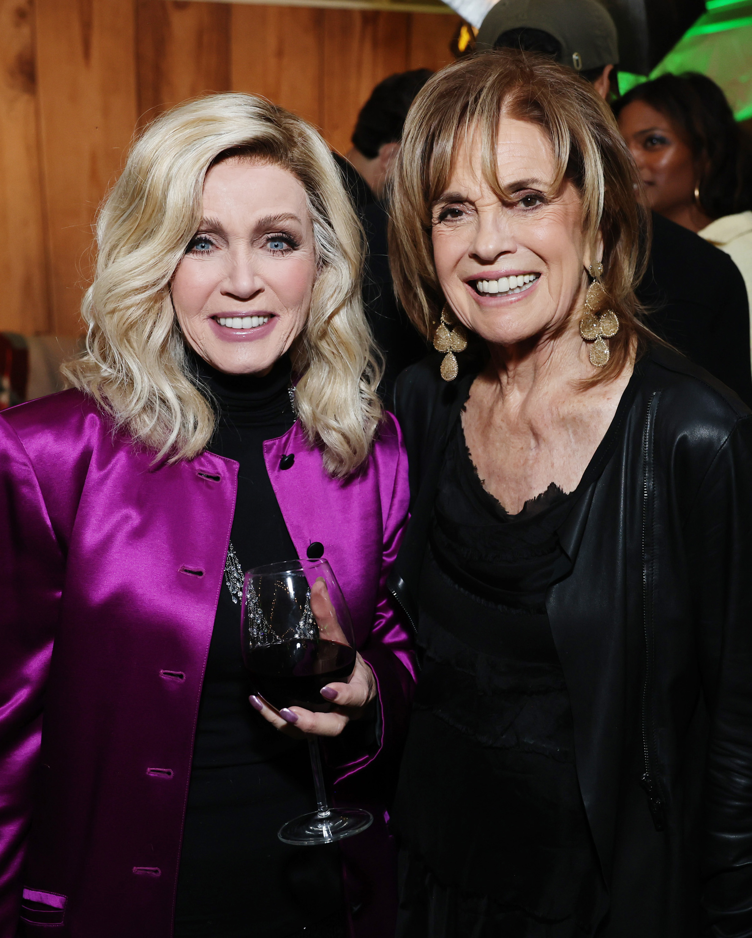 Donna Mills and Linda Gray attend a Holiday Celebration with the Stars of "It's A Wonderful Lifetime", on November 28, 2023 in Beverly Hills, California. | Source: Getty Images