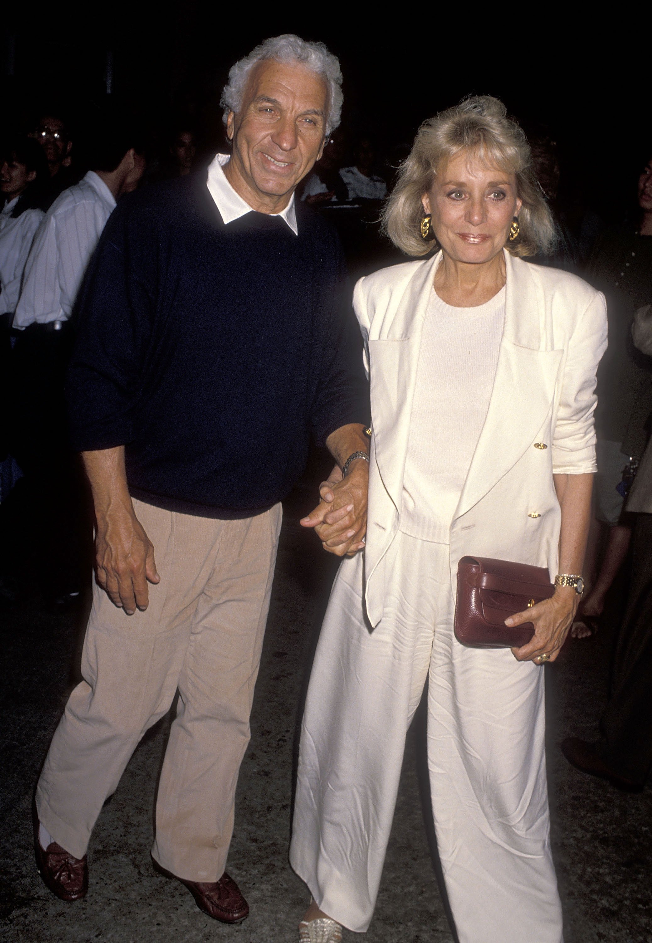 Entertainment executive Merv Adelson and TV journalist Barbara Walters at the "Presumed Innocent" Westwood Premiere on July 25, 1990 at the Mann Bruin Theatre in Westwood, California. | Source: Getty Images