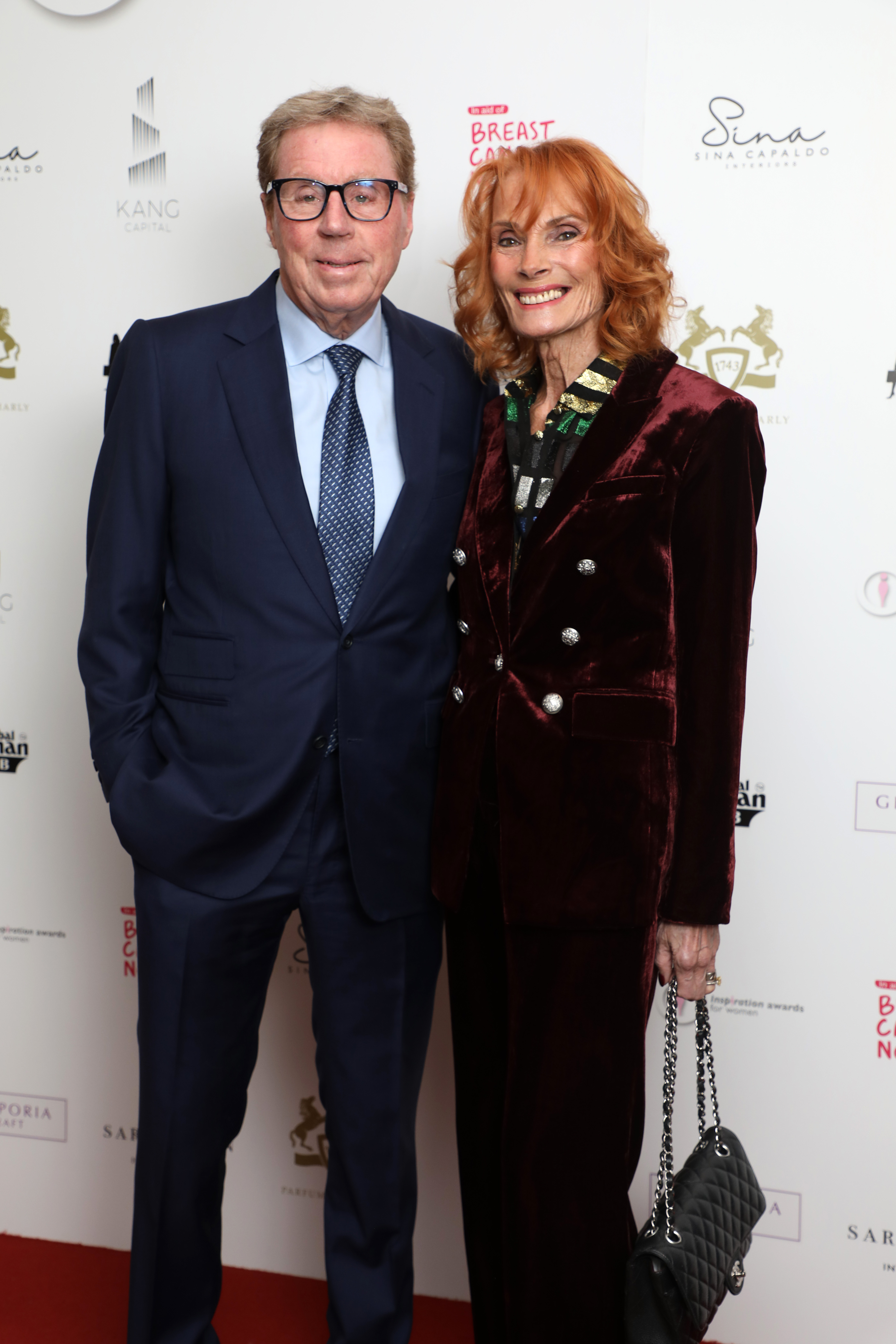 Harry and Sandra Redknapp appeared in high spirits at the Inspiration Awards for Women on 20 January 2023 at The Landmark Hotel in London, with Sandra in a burgundy velvet suit and Harry in a navy suit and tie, the couple posing closely together on the red carpet — a composed and confident appearance that reflected their enduring partnership in later years.