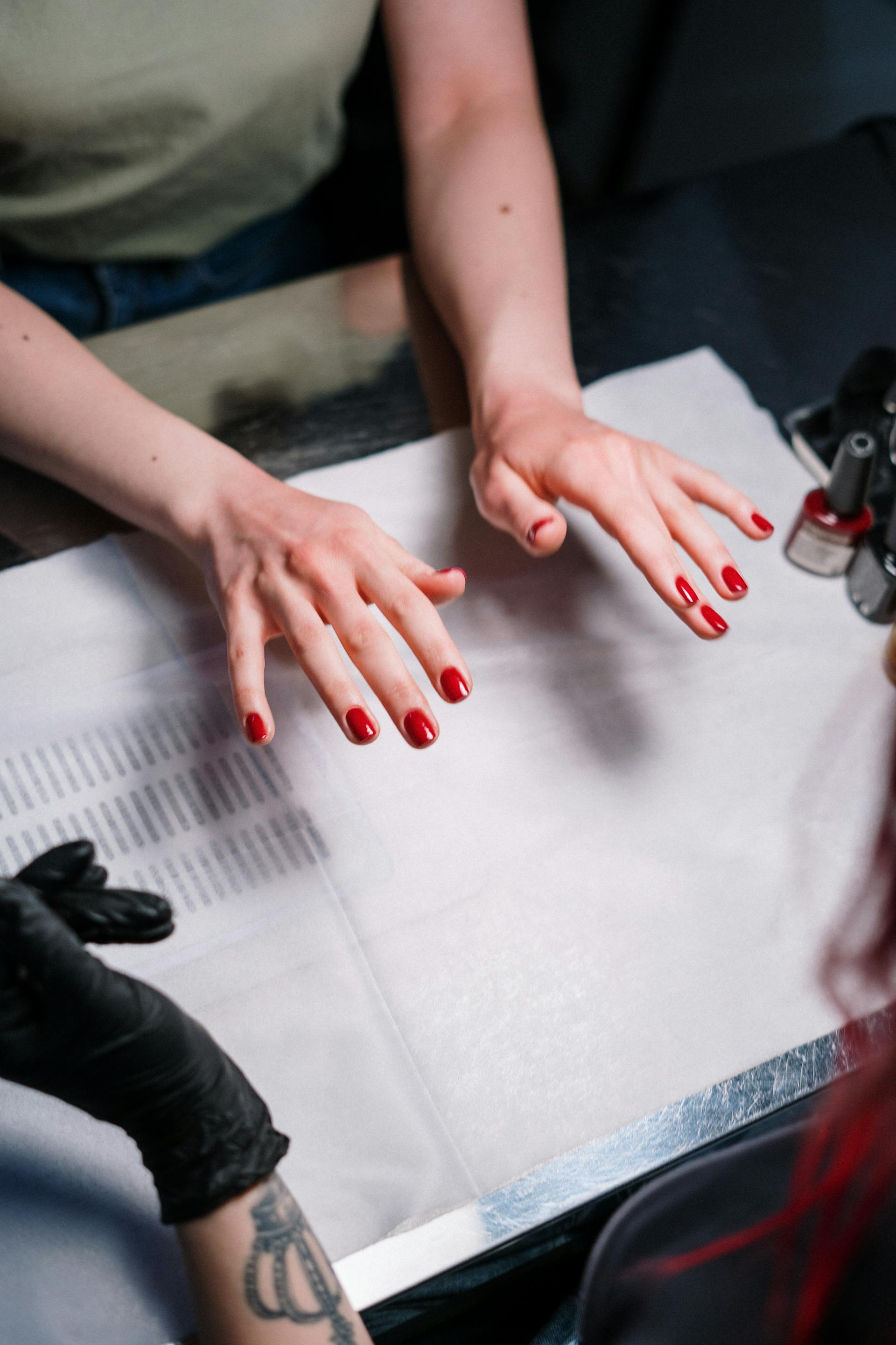 A person with a red manicure | Source: Pexels